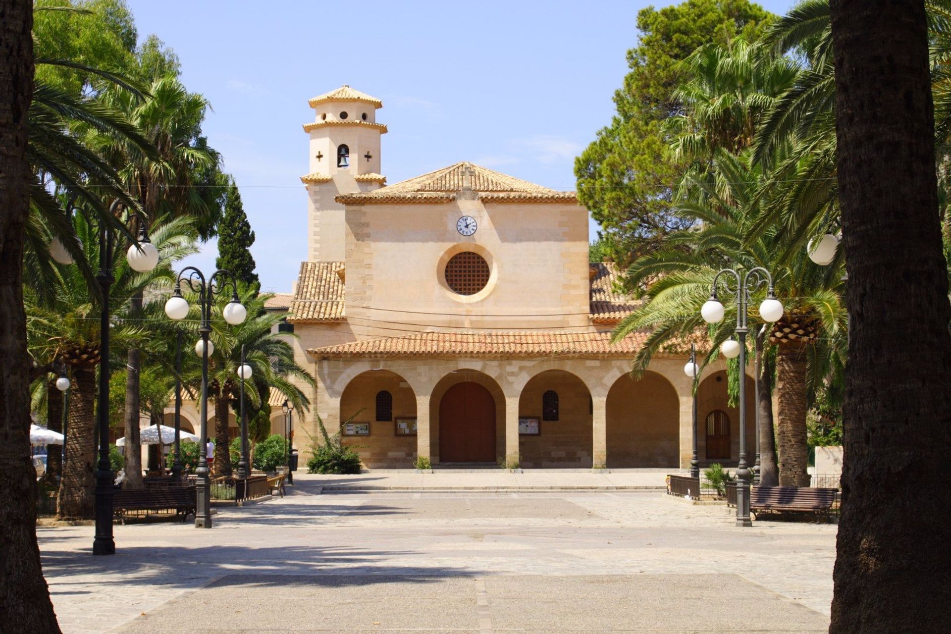 Small sandstone church in Pollensa's town square