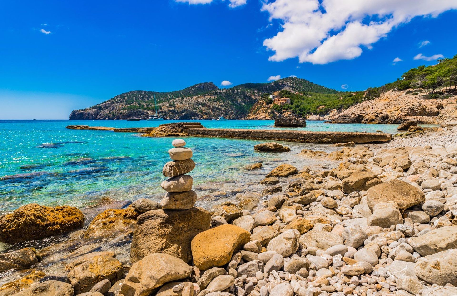 The Pebbly coastline and turquoise waters of Camp de Mar, southwest Majorca