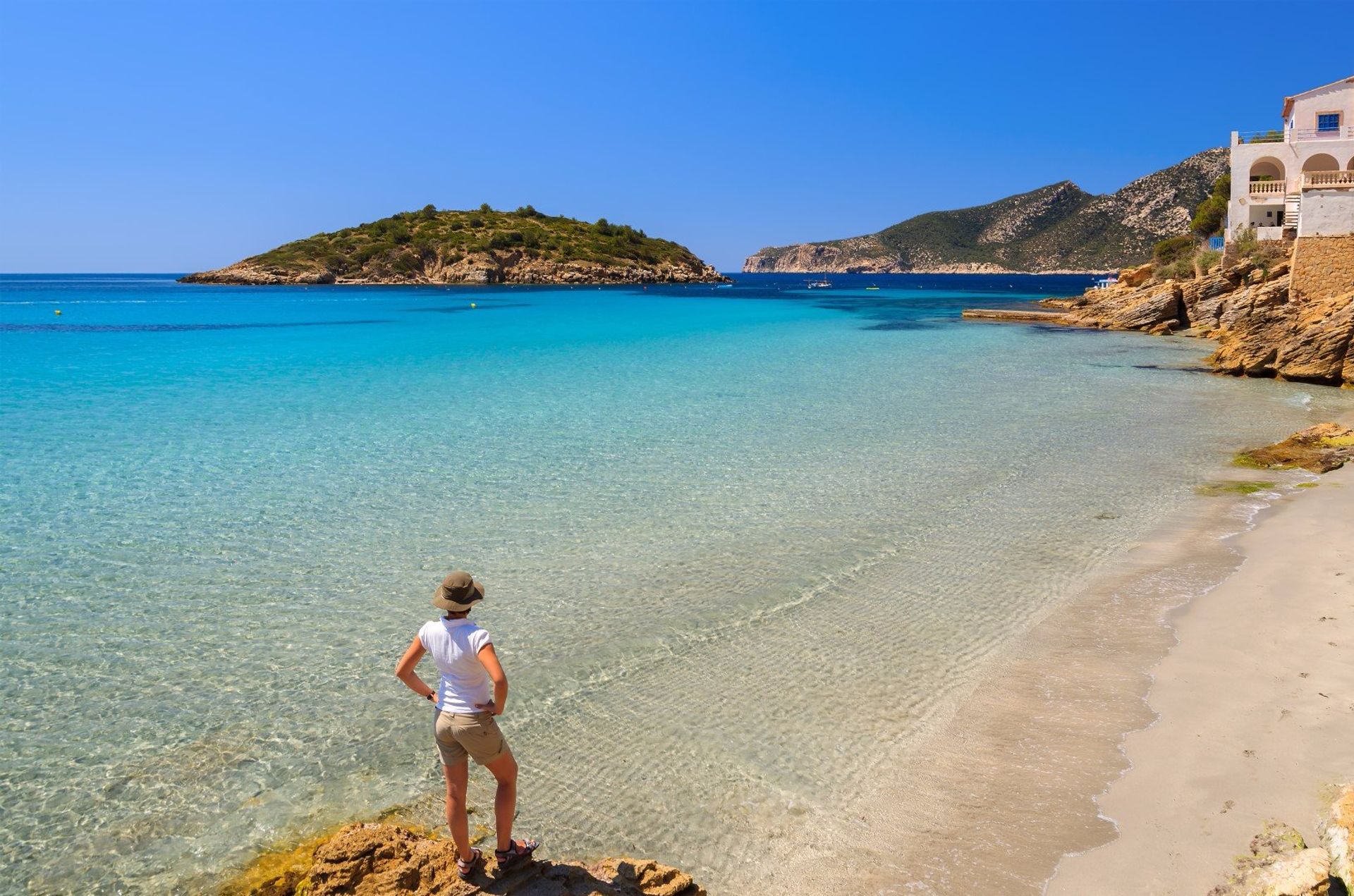 The serene sandy beach of Sant Elm