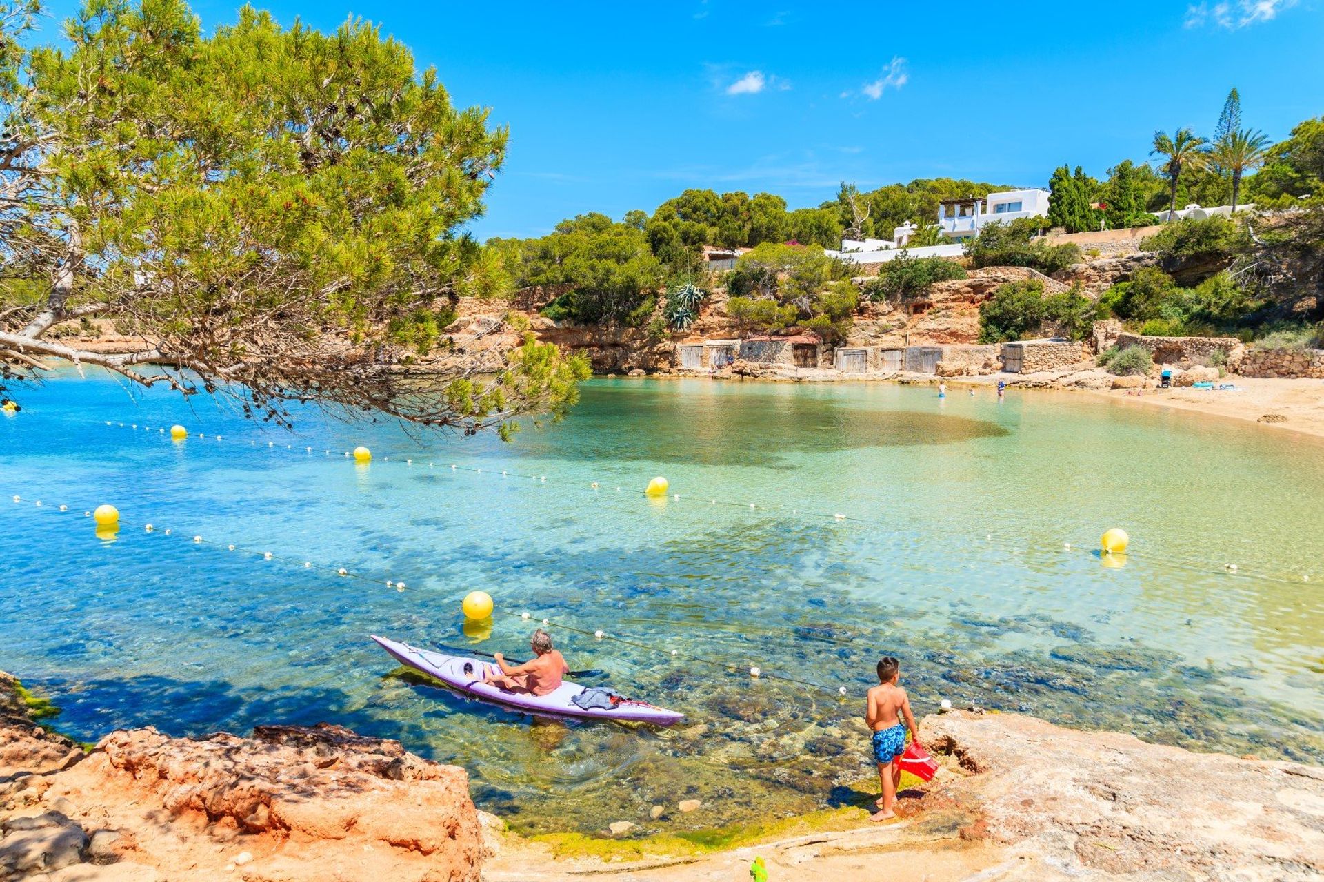 Kayaking in the transparent sea of Cala Gracio beach