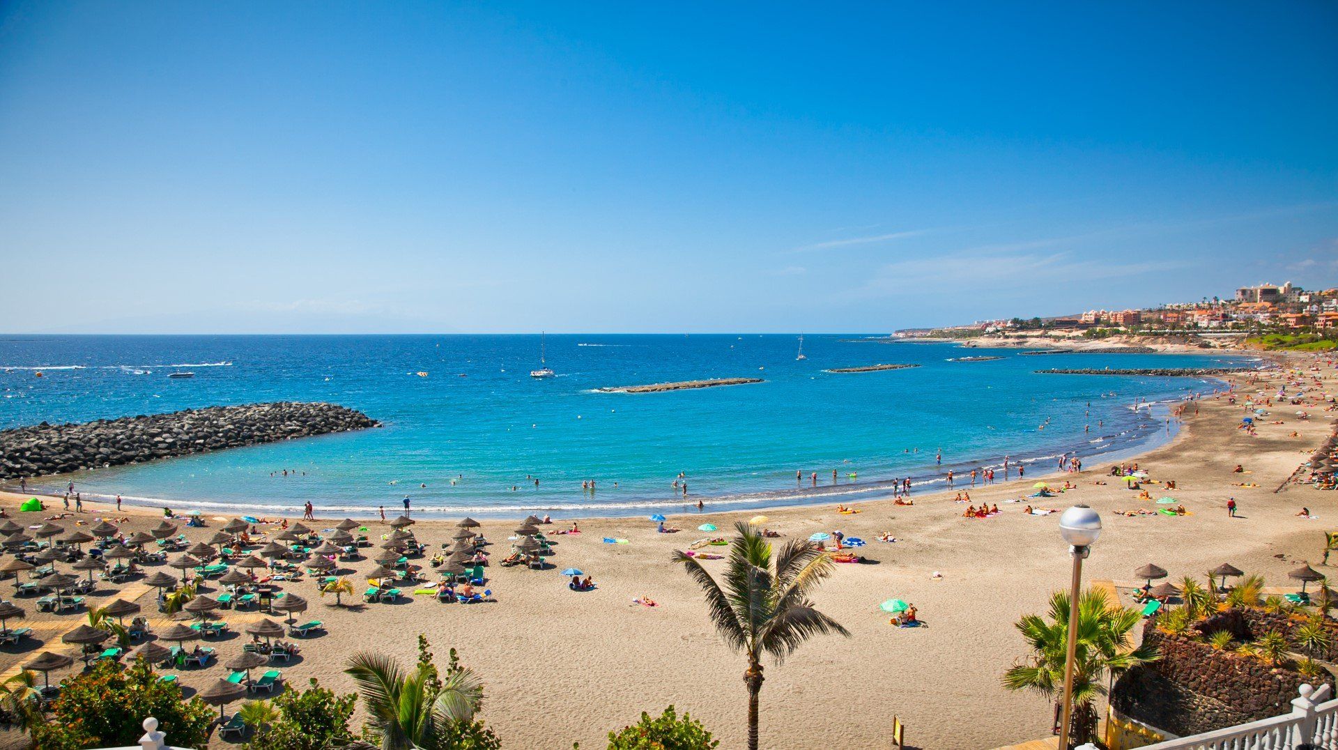 The aerial view of Playa de las Americas' main beach Troya beach, with its golden sand and aquamarine waters