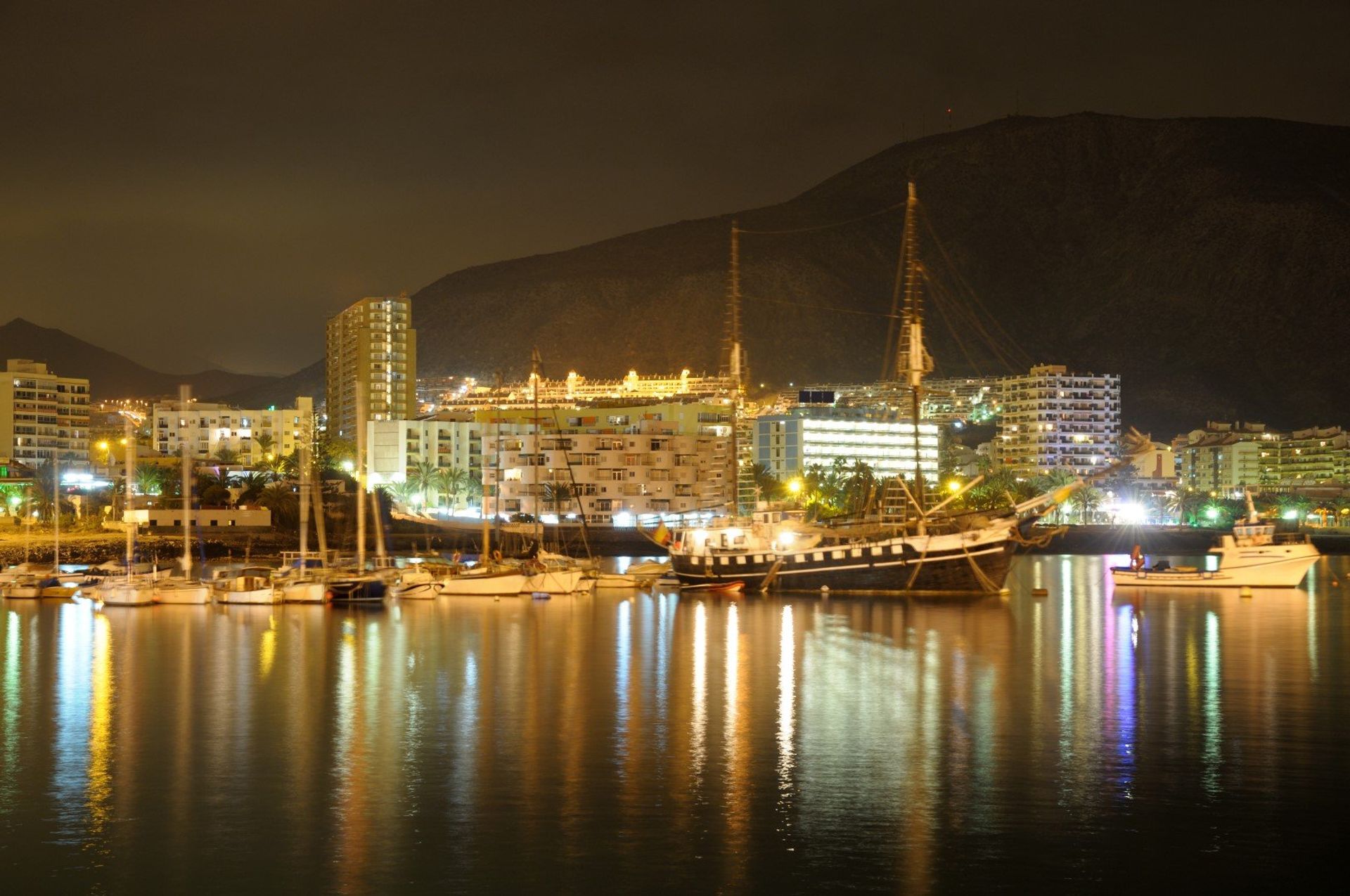 Los Cristianos harbour under the night sky
