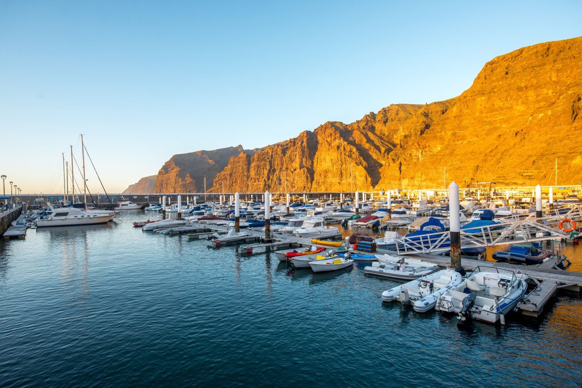 Small harbour with yachts and boats in Los Cristianos town on Tenerife's south coast