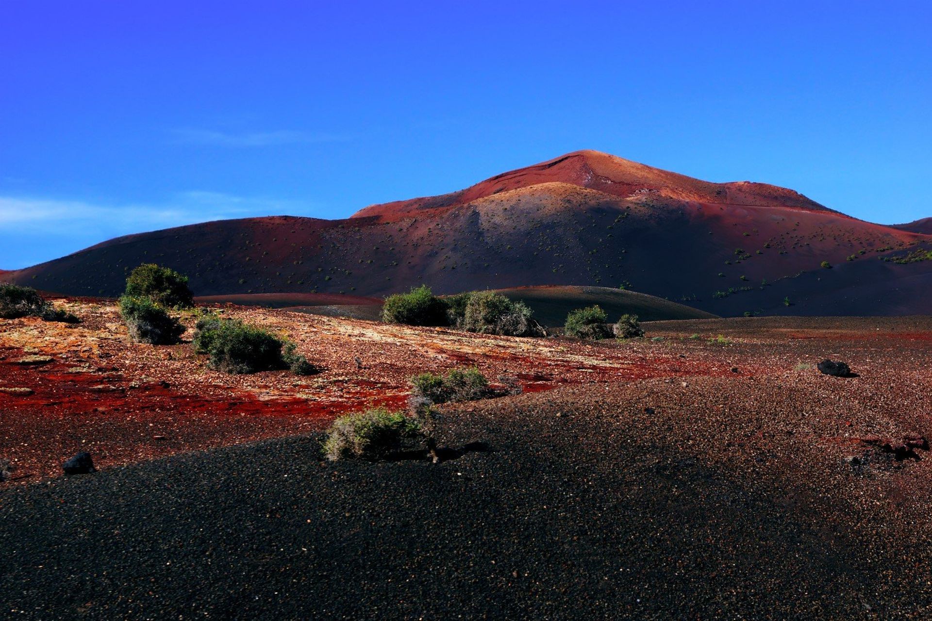 The volcanic landscape of Timanfaya National Park stretching across the districts of Tinajo and Yaiza