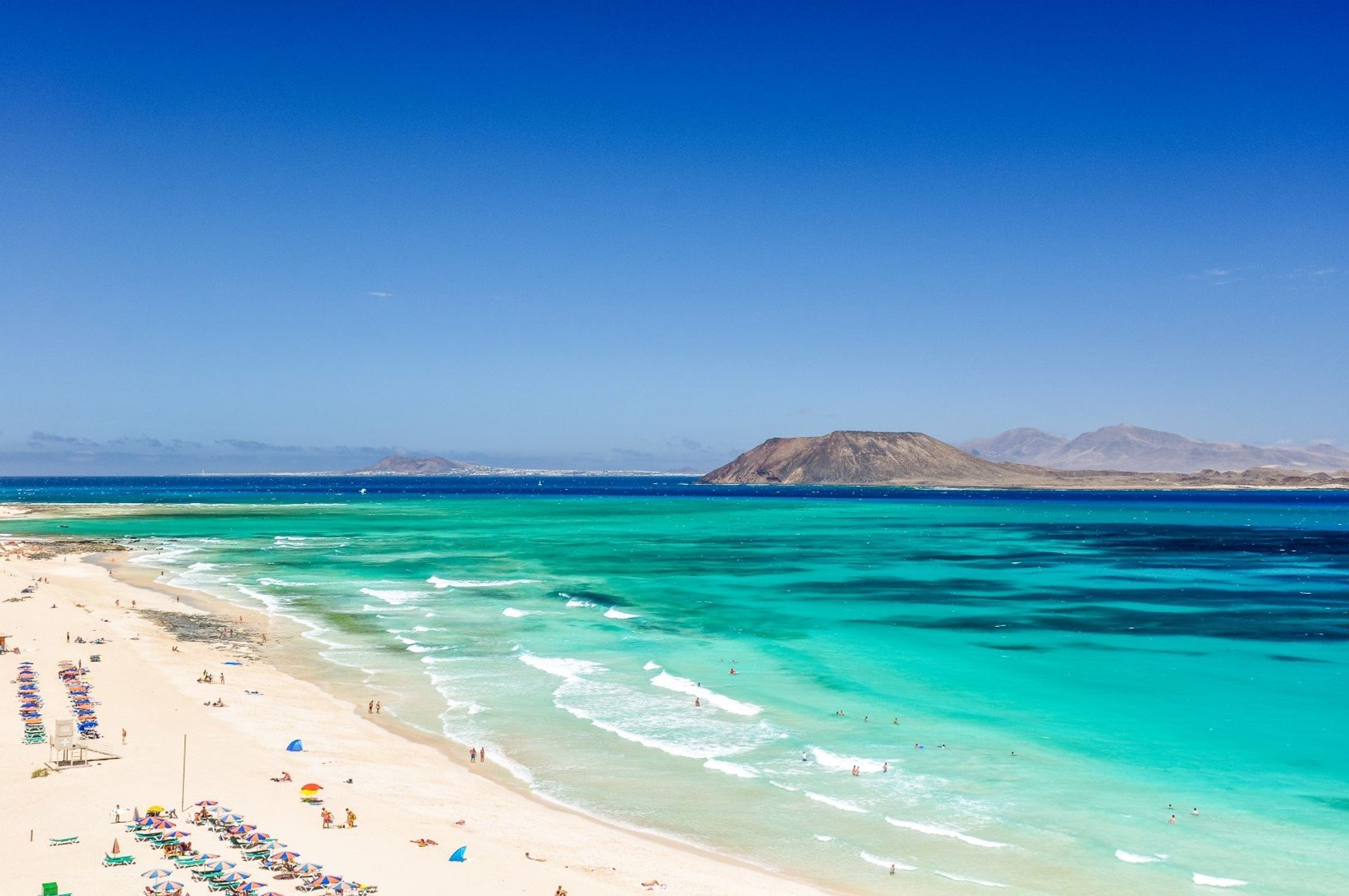Panoramic views of Lobos Island and Lanzarote, seen from Corralejo Beach 