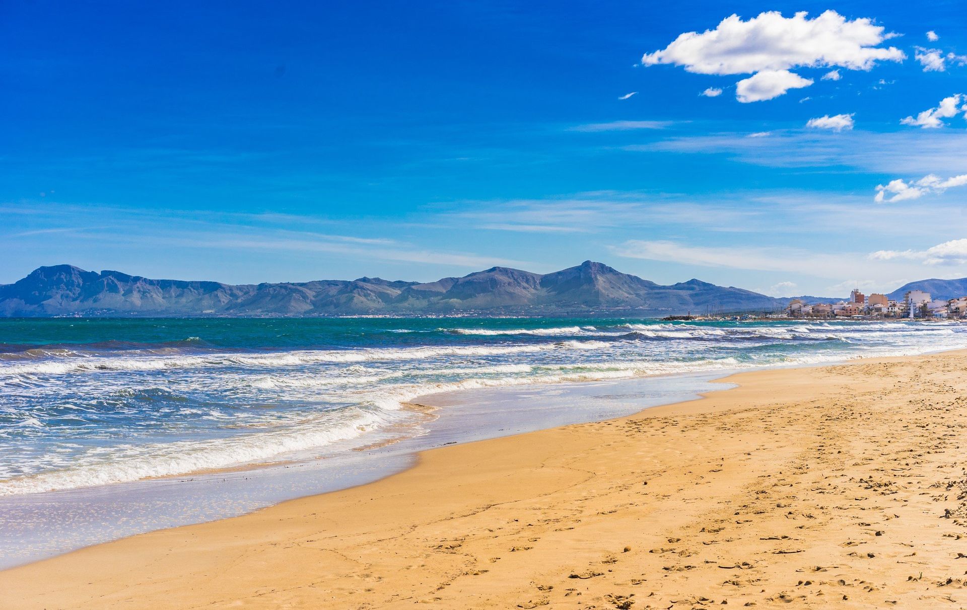 The golden coast of Platja de Muro beach in Can Picafort resort