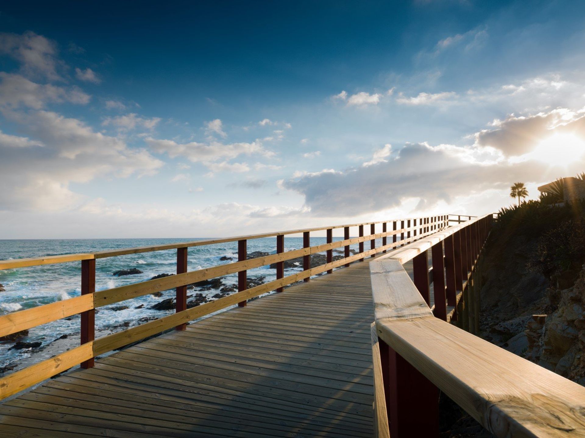 The breathaking wooden promenade of Calahonda Beach at sunset, 30 minutes from Mijas Town