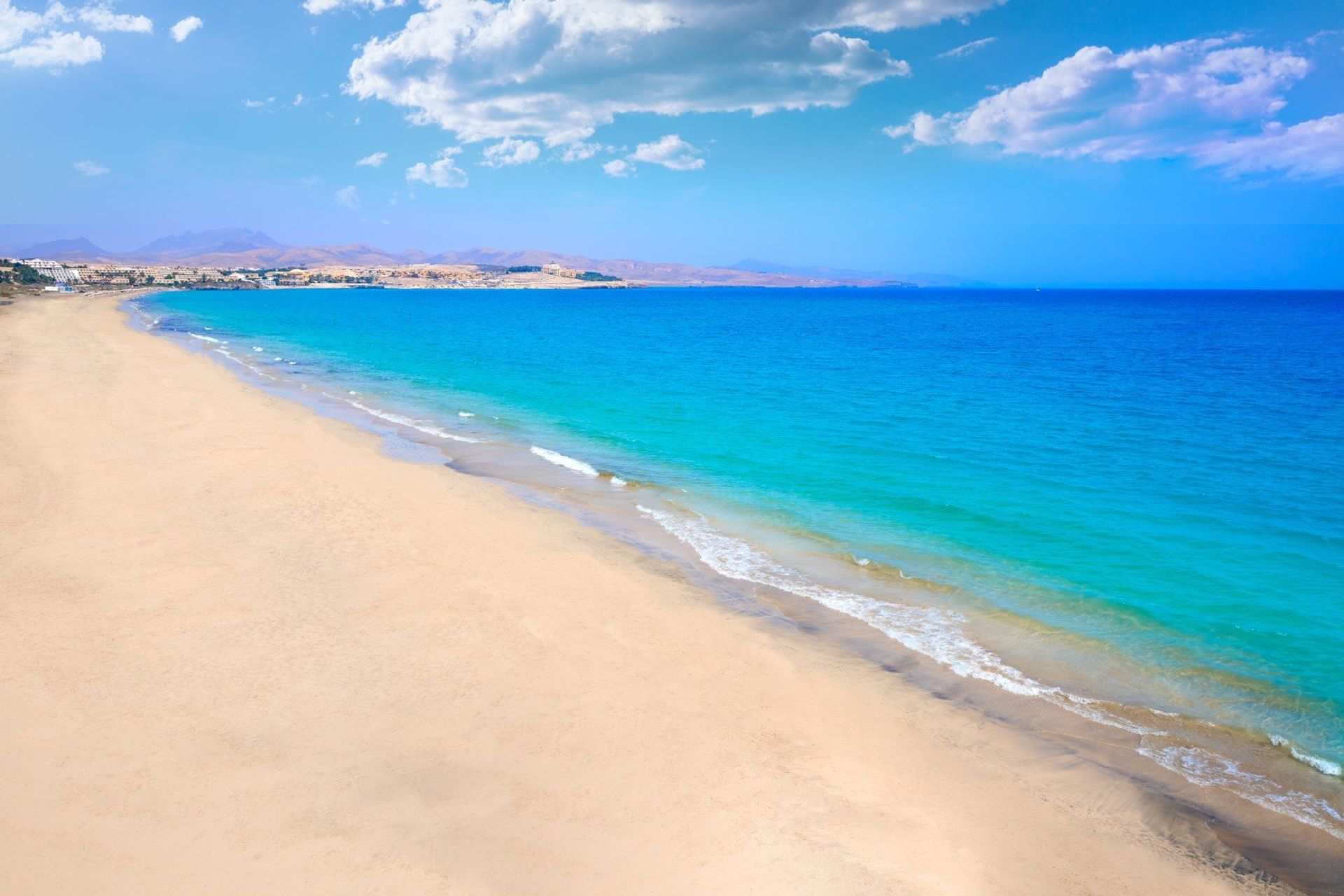 The stretch of white sand and aquamarine waters of Costa Calma beach on Jandía peninsula