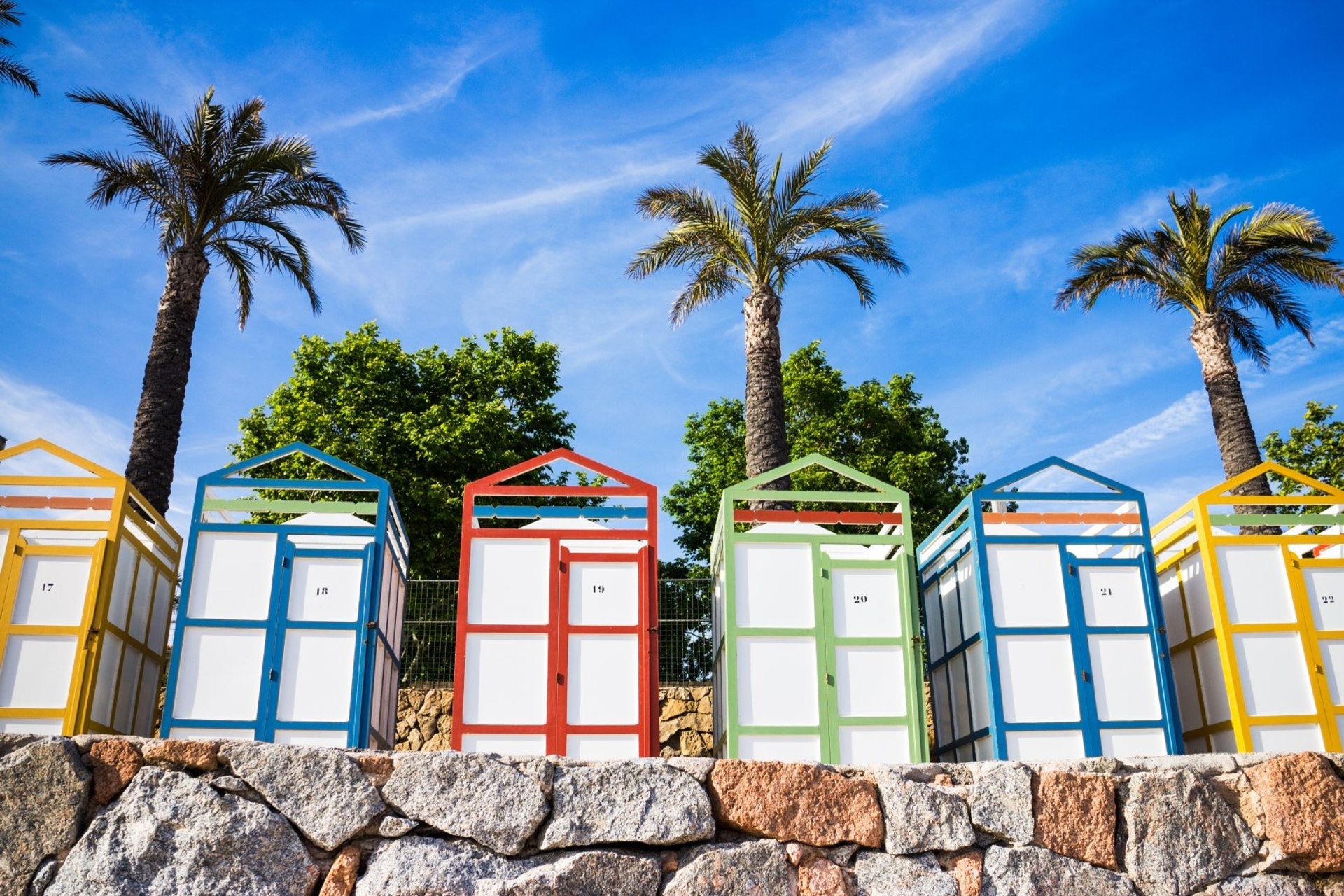 The colourful beach houses of Sagaro beach in the province of Girona