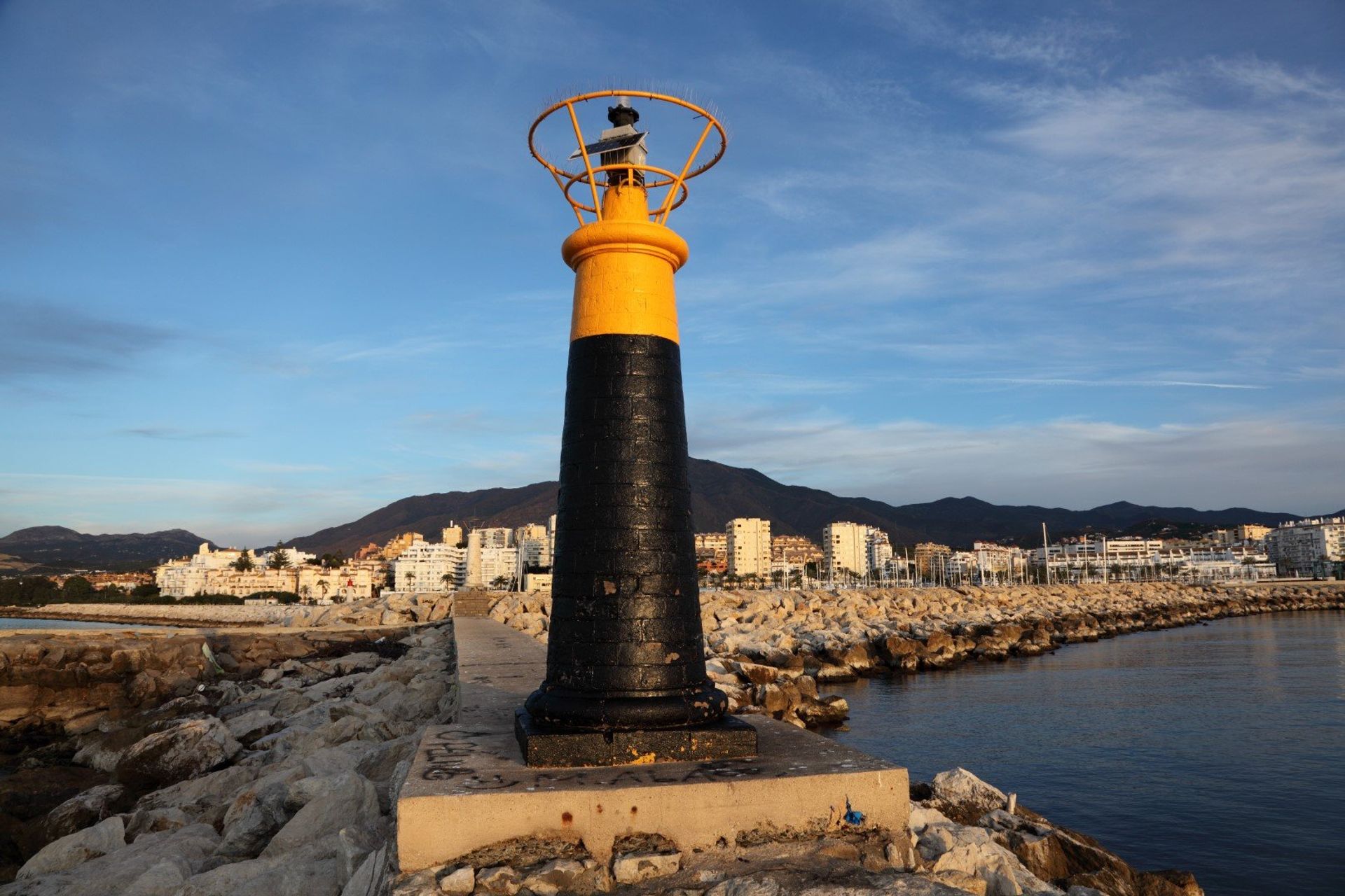 The striking lighthouse on Estepona's cobblestoned waterfront 