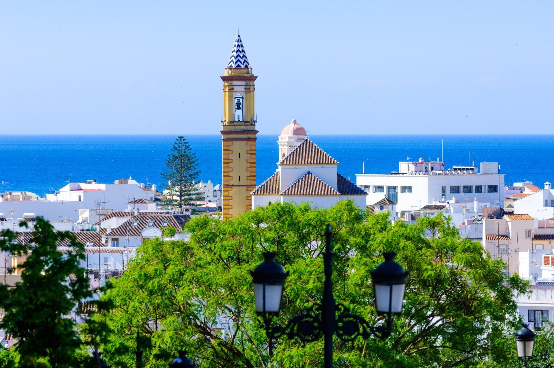 Estepona's bell tower rising above Flower Square in the old town