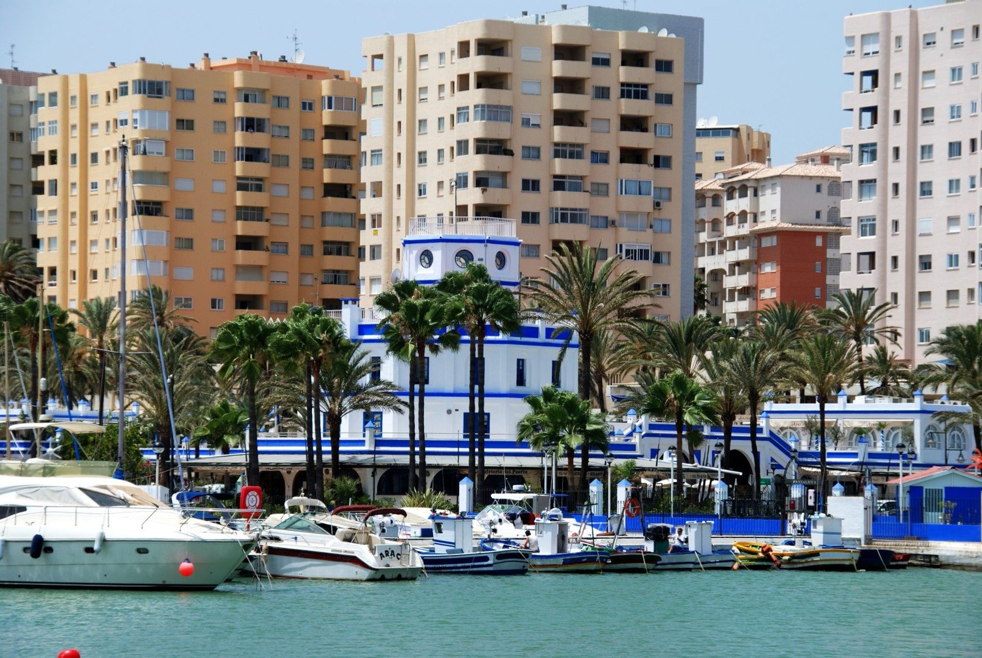 Estepona Harbour with its colourful cityscape backdrop