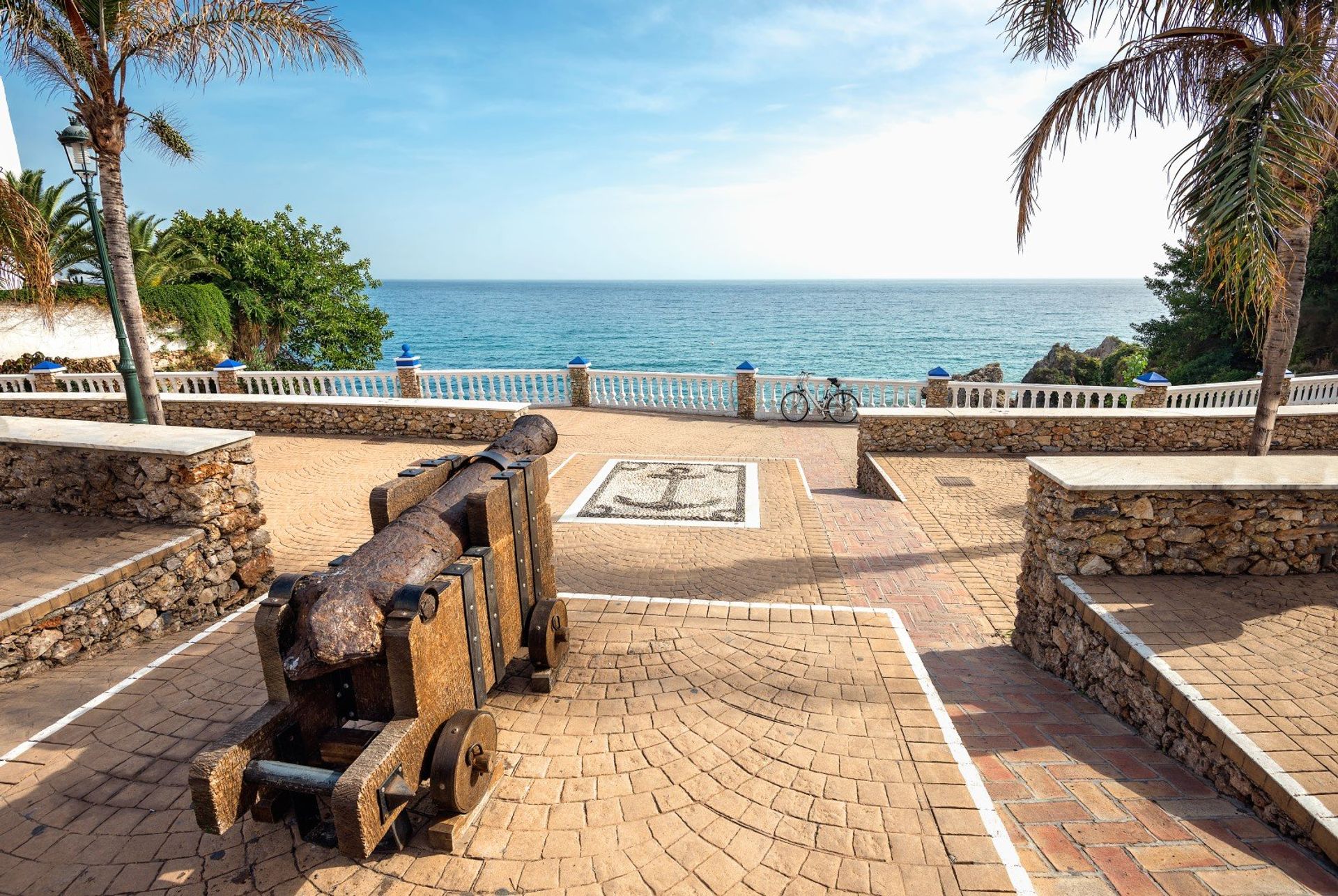 Coastal views with the ancient cannon on local Carabeillo beach by the Balcón de Europa