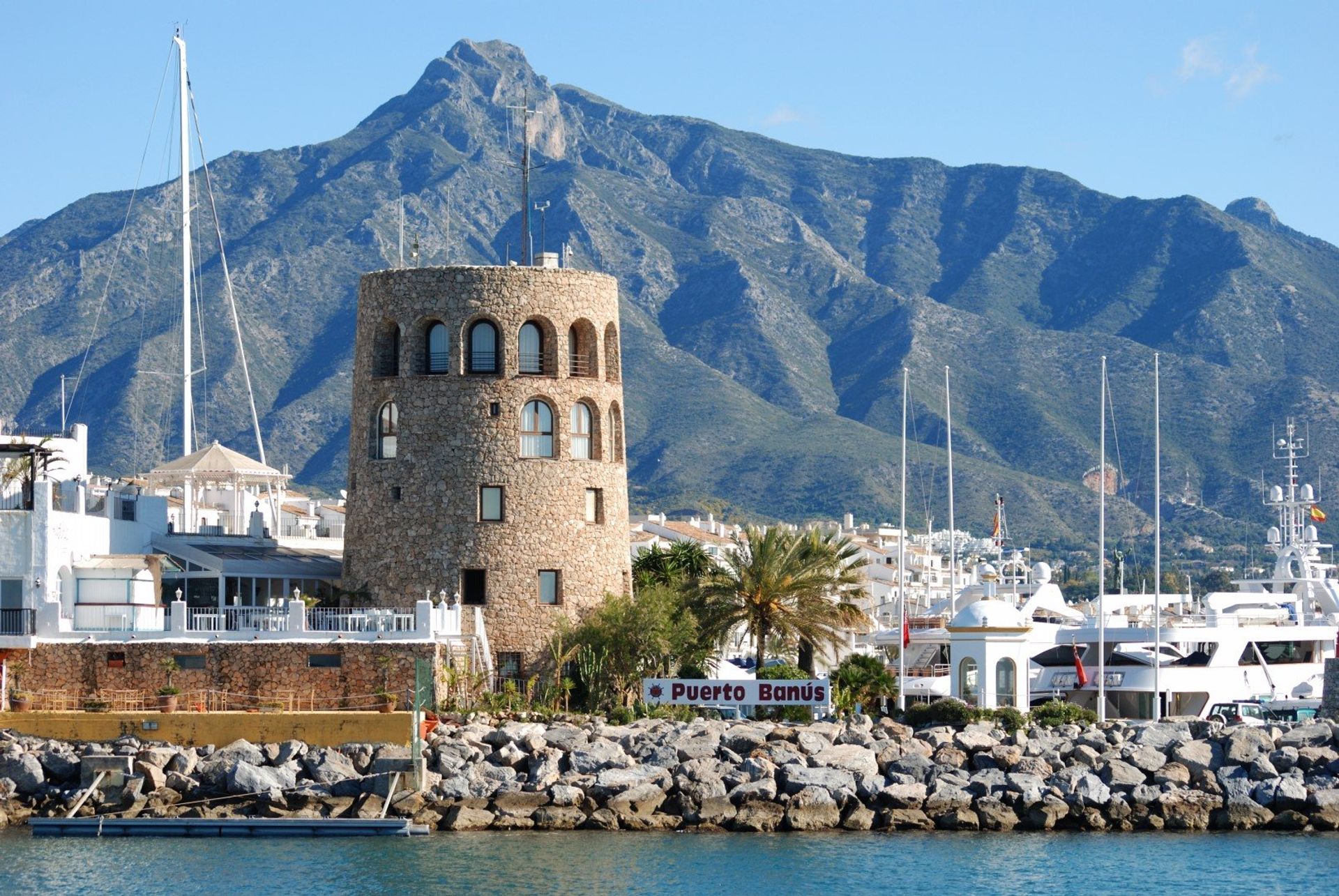 Puerto Banús harbour with the watchtower to the left and La Concha mountain in the distance