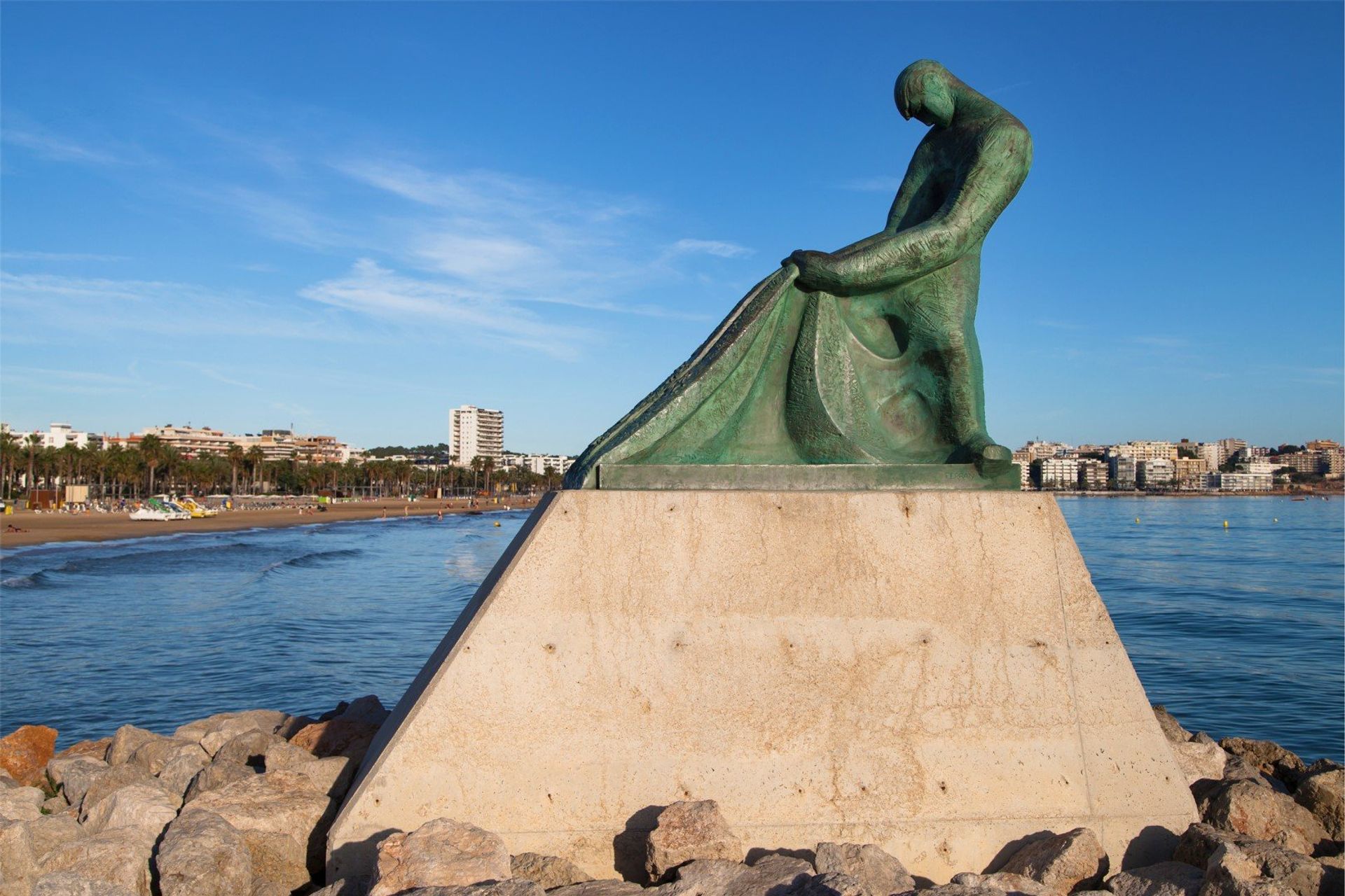 Fisherman's memorial, designed in 1990 by Ramon Ferran, located on the pier between the the beach, the sea and the marina