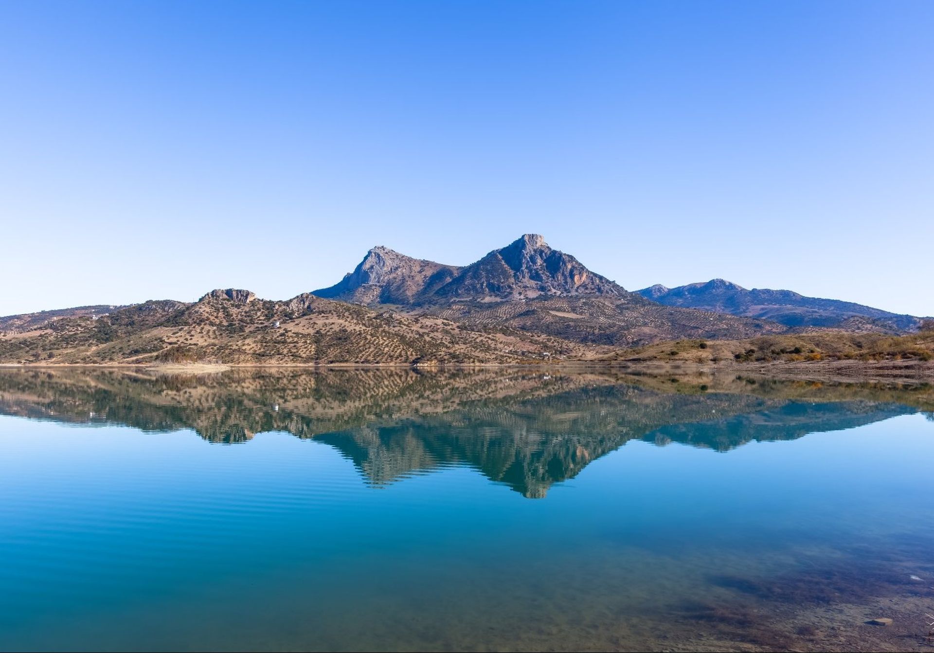 Crystal-clear waters and mountain peaks in the backgrounds of Grazalema national park