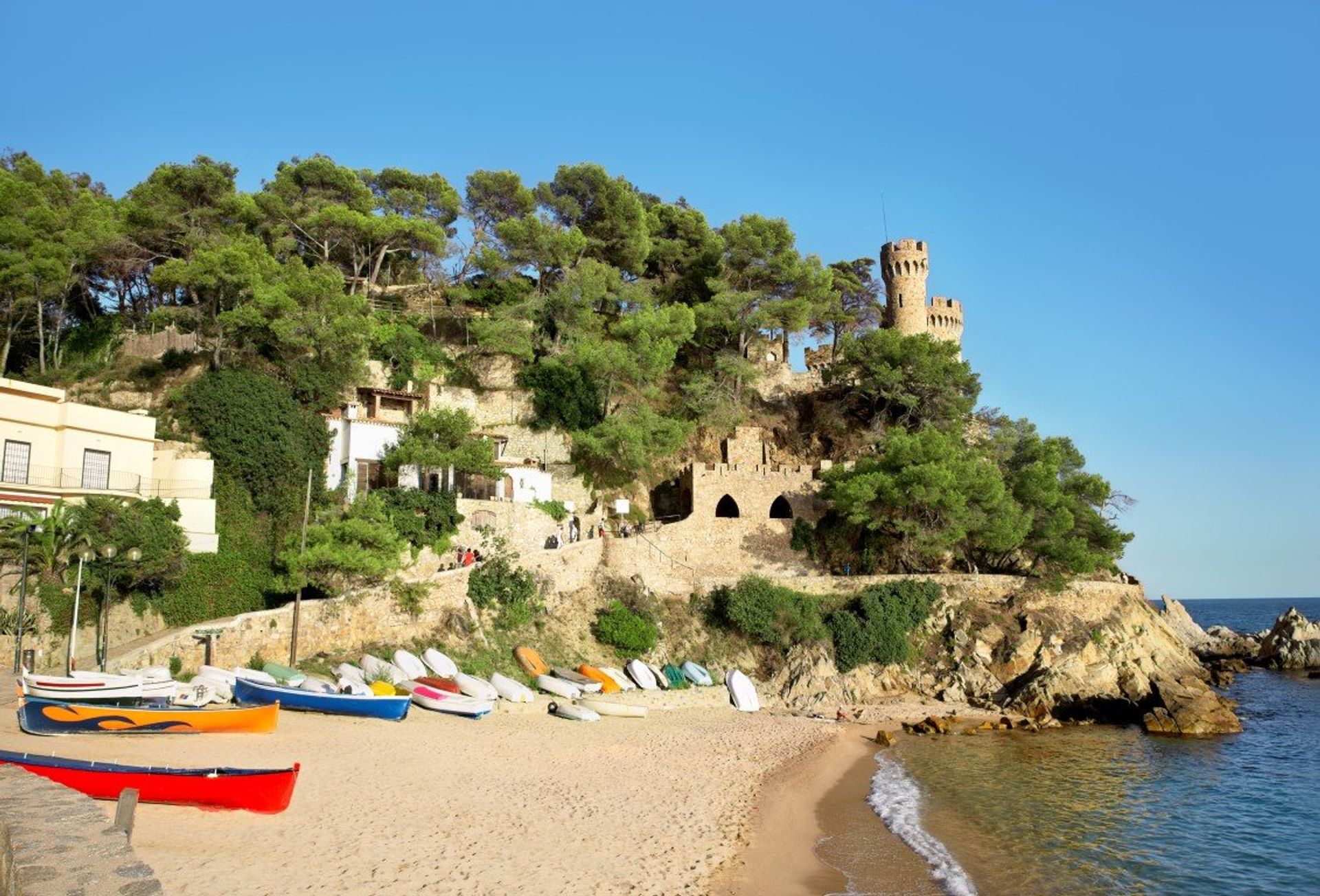 Tossa de Mar's ancient town in the distance with the fortified walls of Sant Joan's Castle