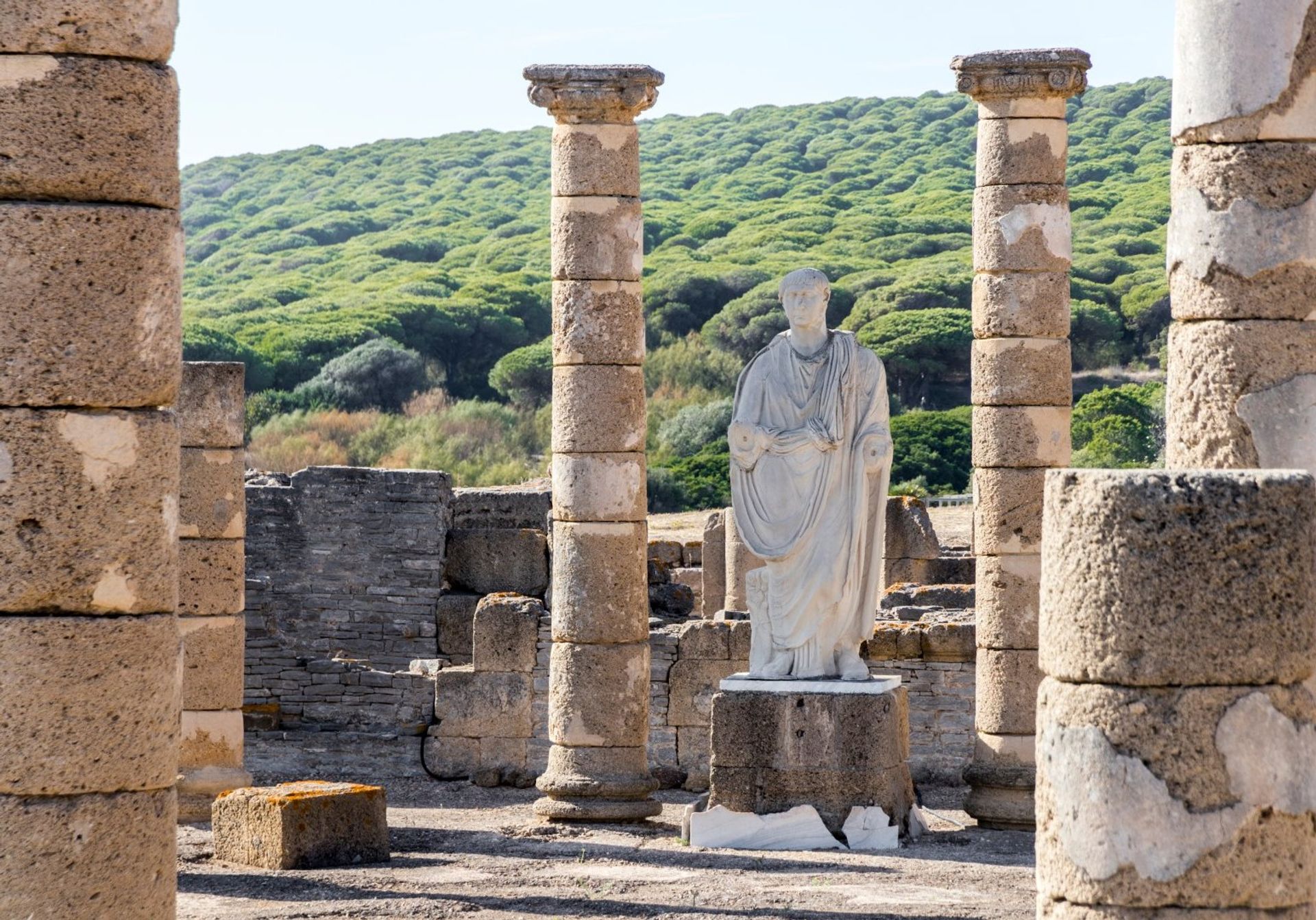 By Bolonia Beach lies the ruins of an ancient Roman town with its stone columns and statues