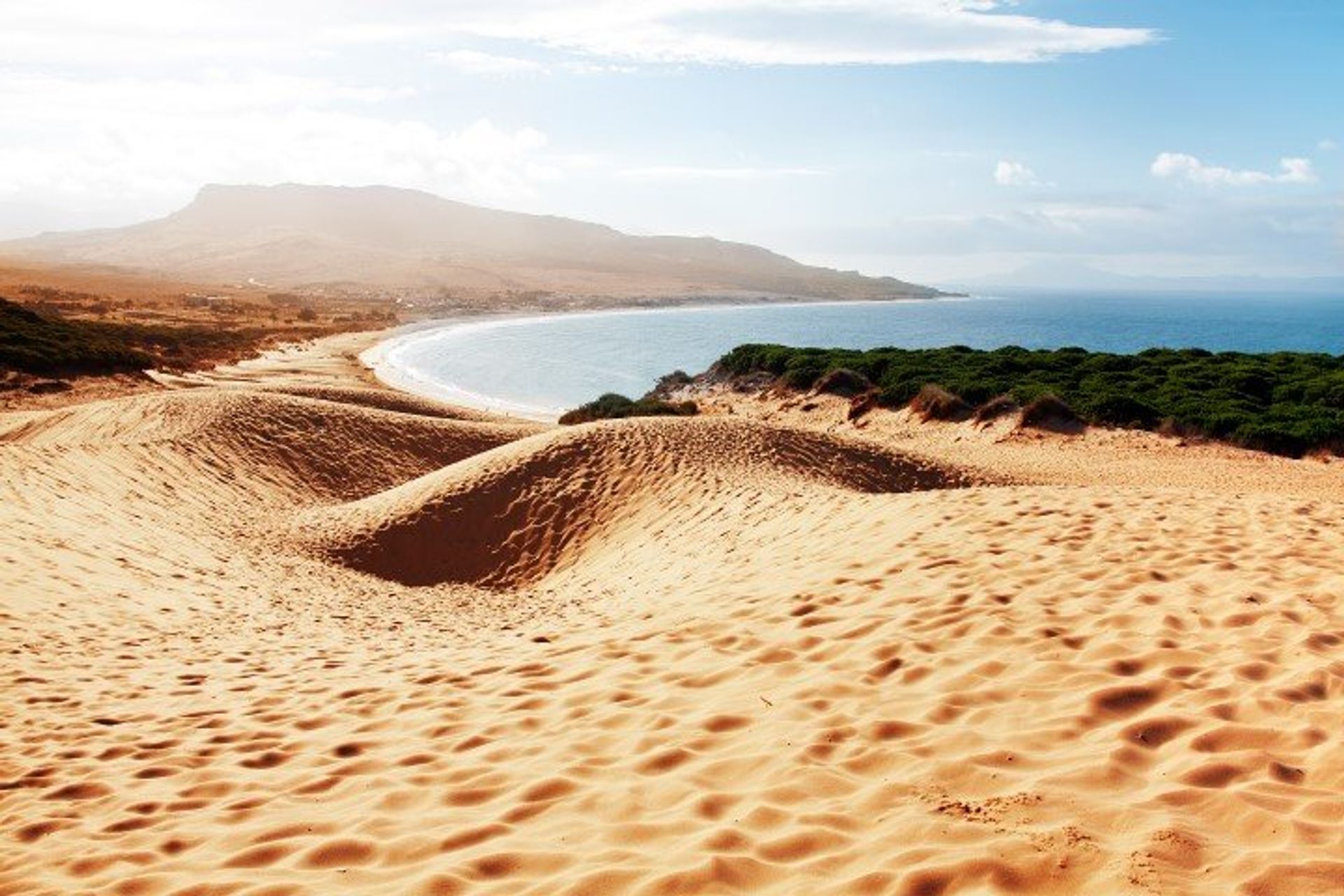 Visit the sand dunes of Bolonia Beach in Cádiz and watch the sunset with an evening stroll along the coast