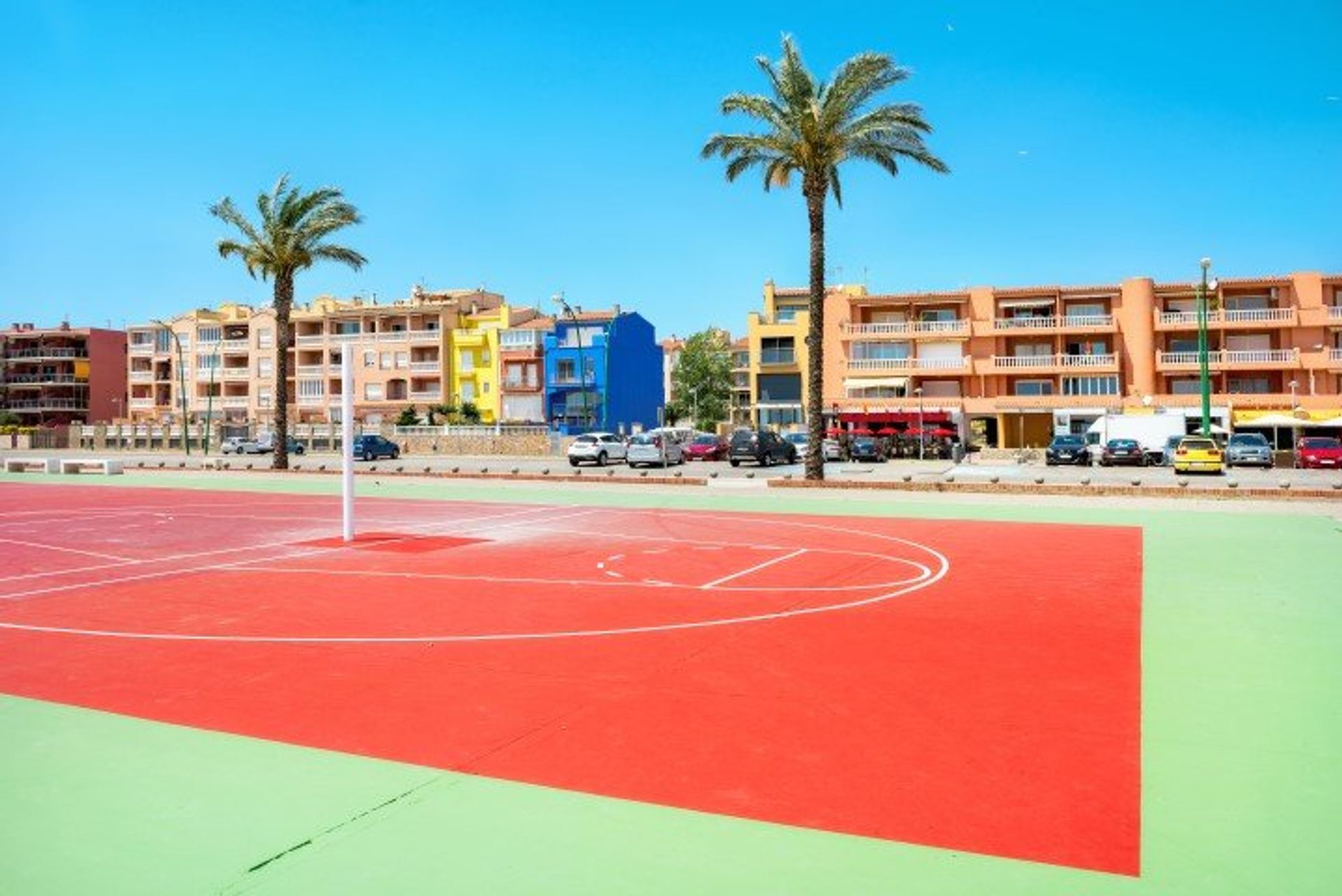 Kids will love Empriabrava town's colourful sports ground, with its modern basketball court