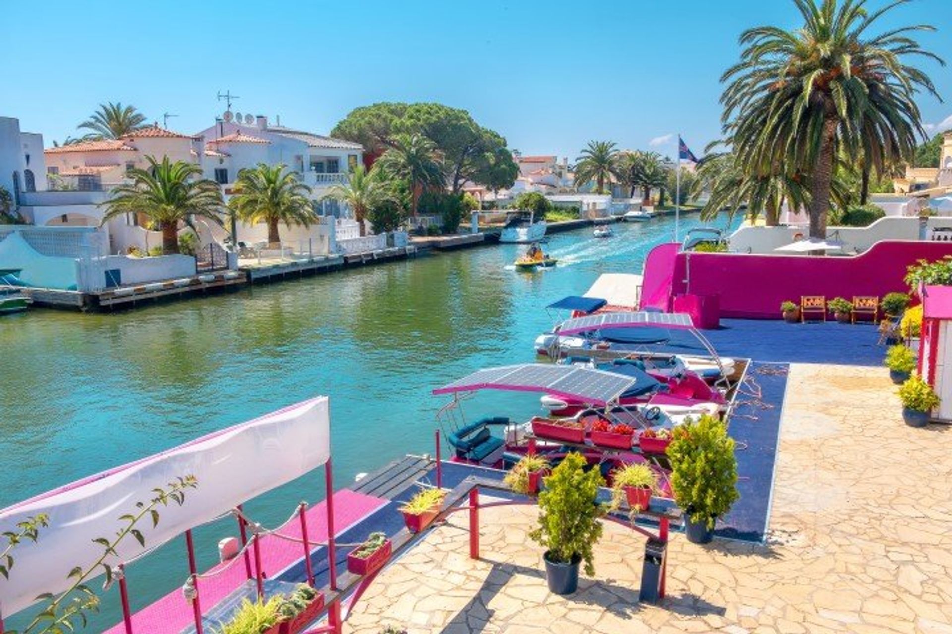 Take a canal boat tour along the colourful waterfront with its luxury villas