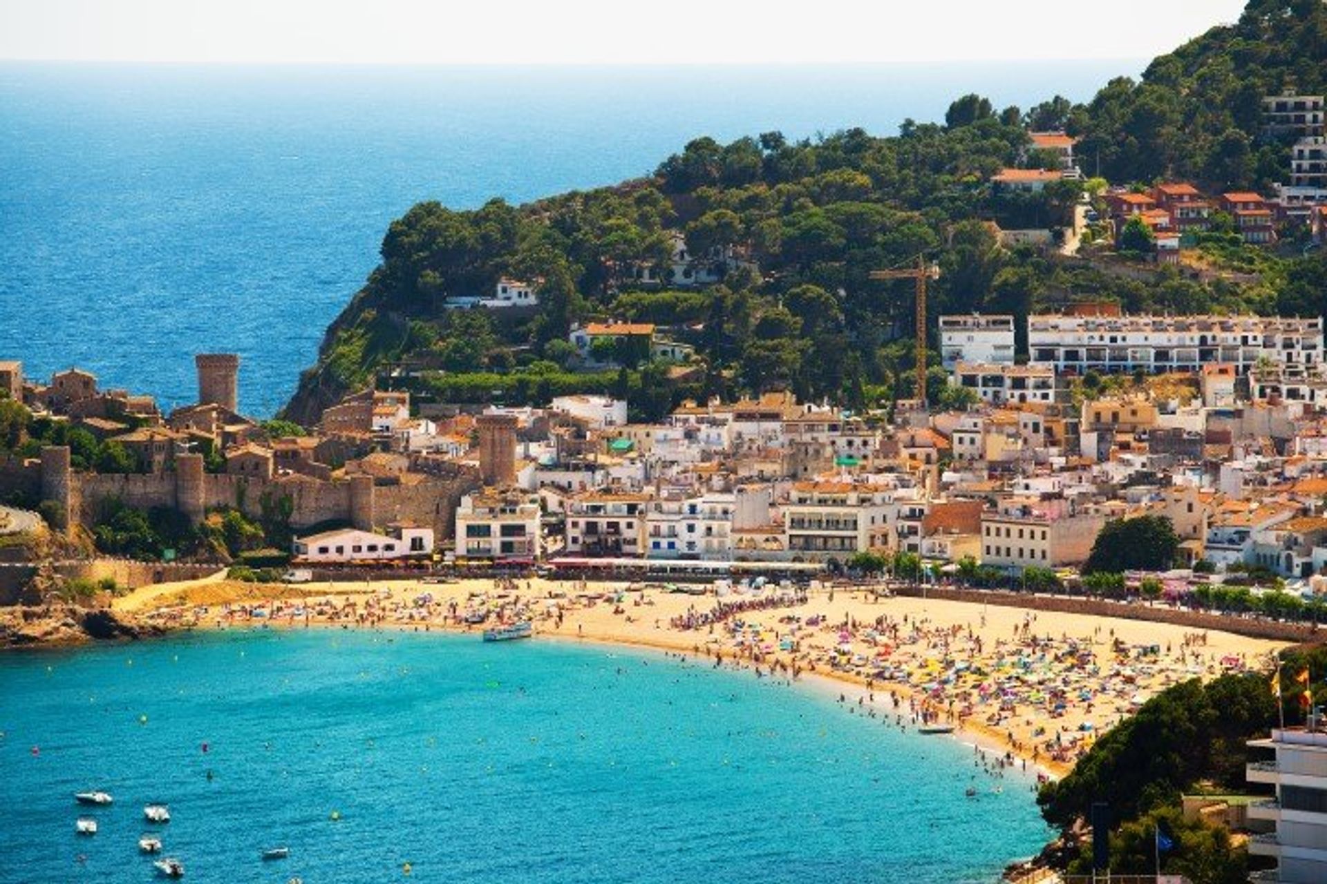 Tossa de Mar's beaches are packed and lively, with a beautiful backdrop of forestry and ancient remains