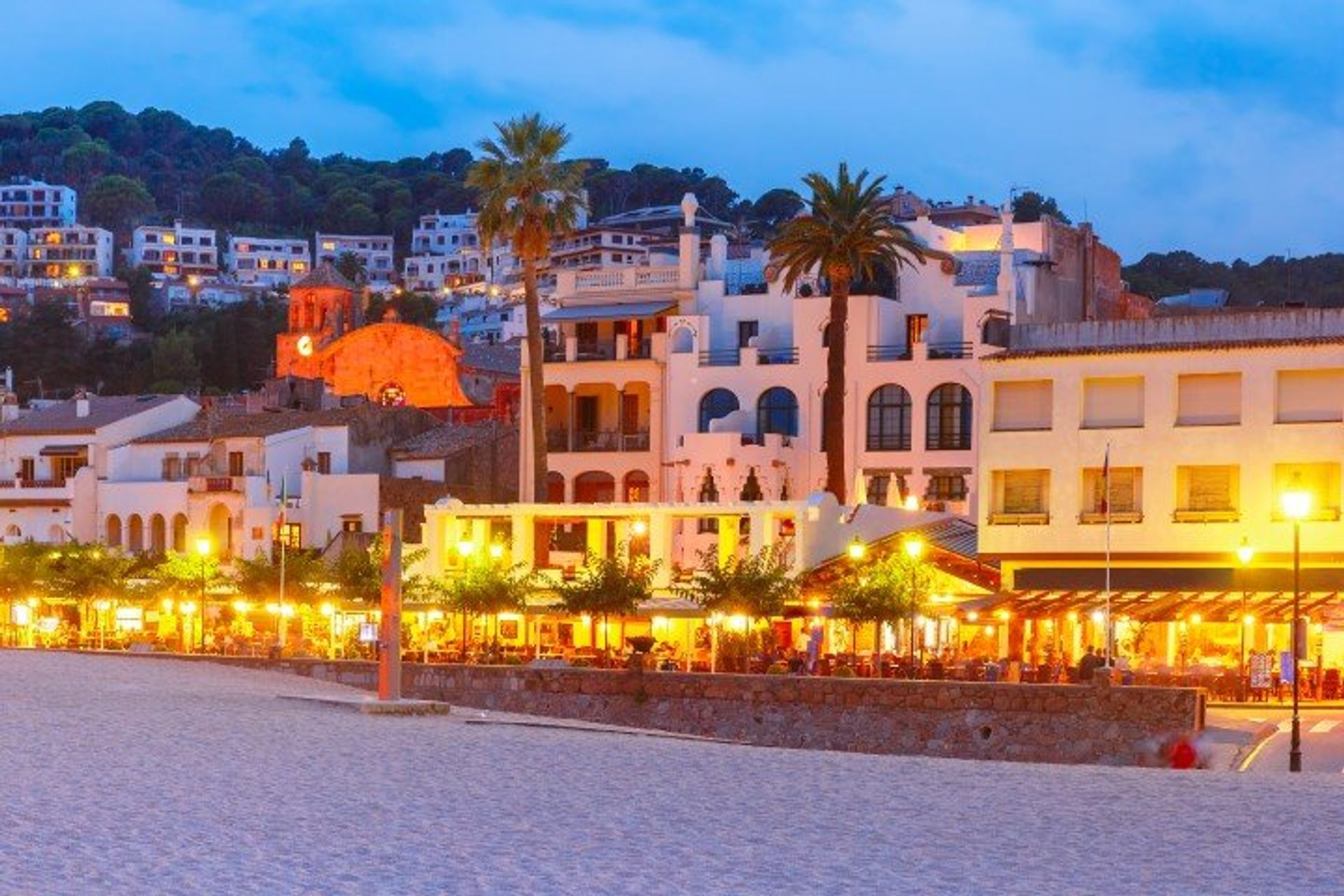 Tossa de Mar's modern palm-lined promenade really comes to life at night
