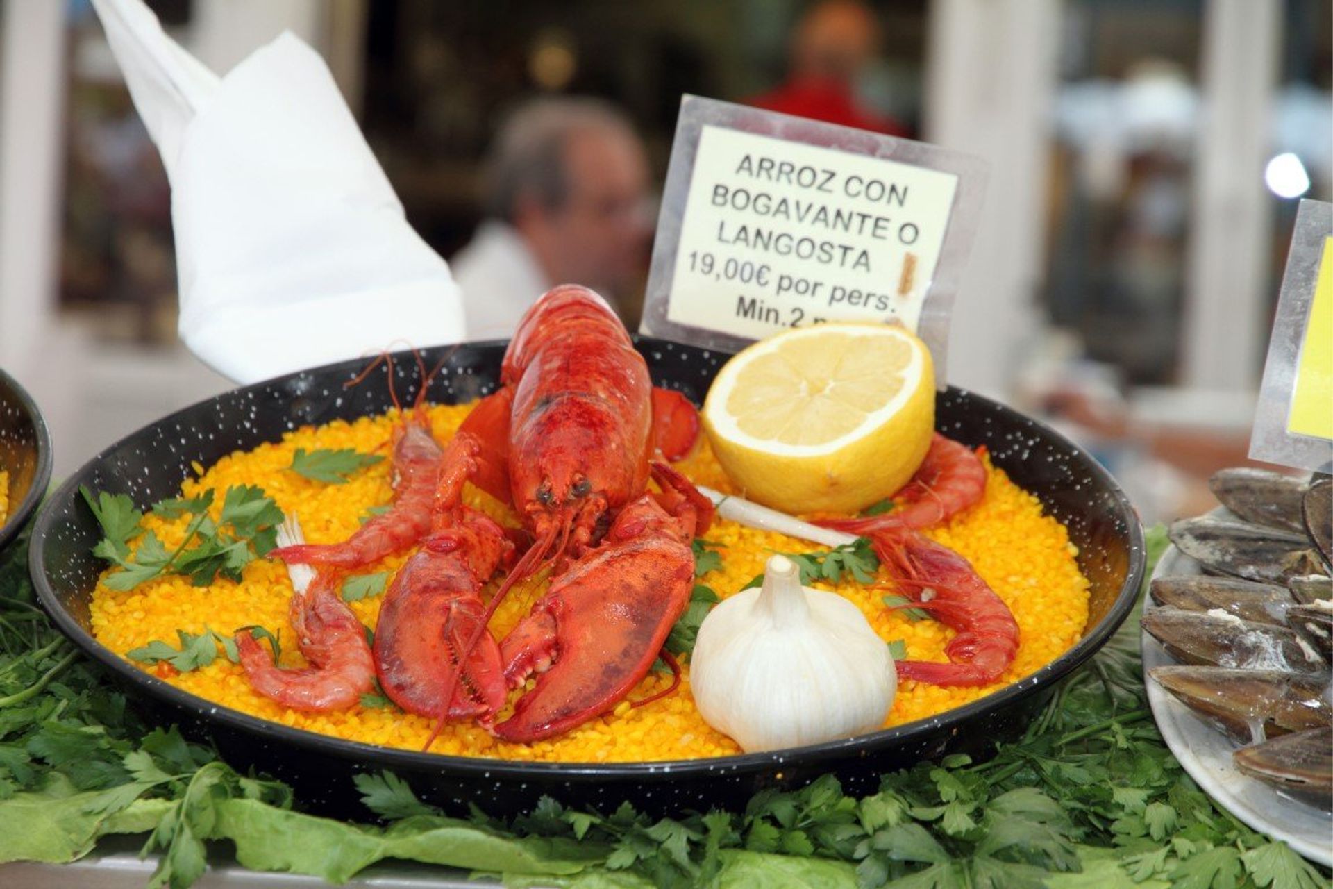 Enjoy an alfresco meal of traditional seafood paella