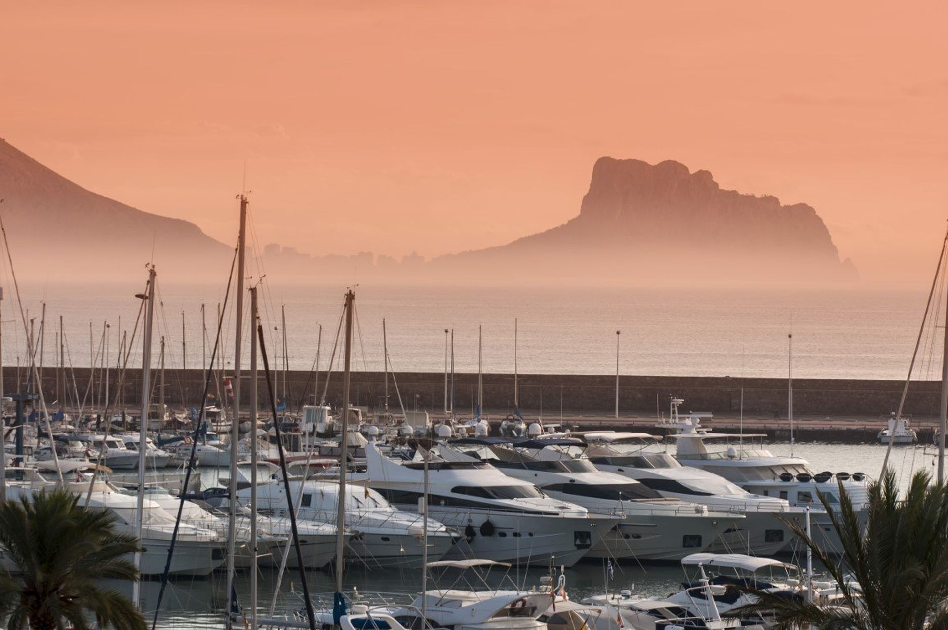Take a sunset stroll down the marina and watch the luxury yachts set against a backdrop of mountains