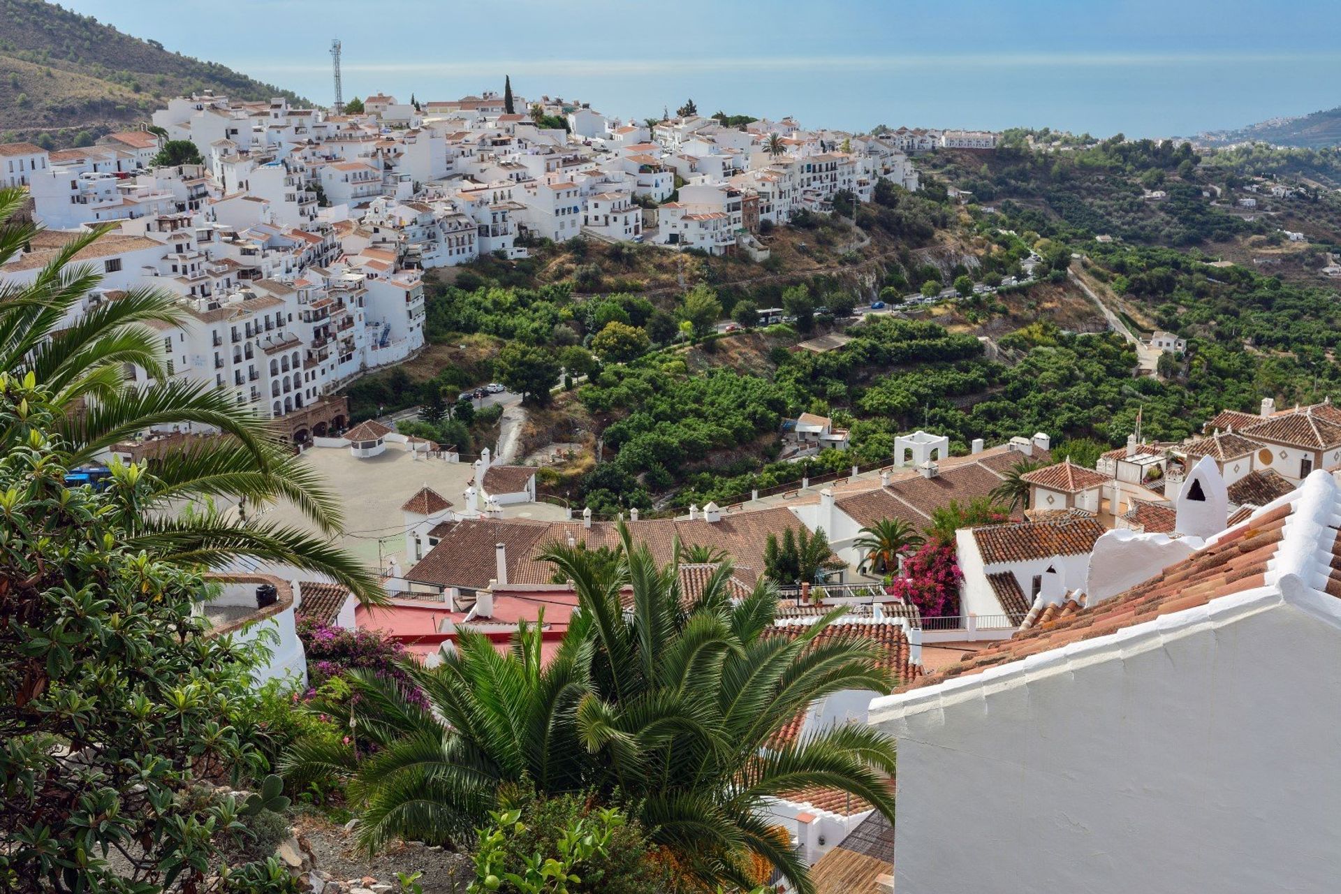 Explore the maze of cobbled winding streets crowded with spotless whitewashed houses decorated with colourful flowerpots 