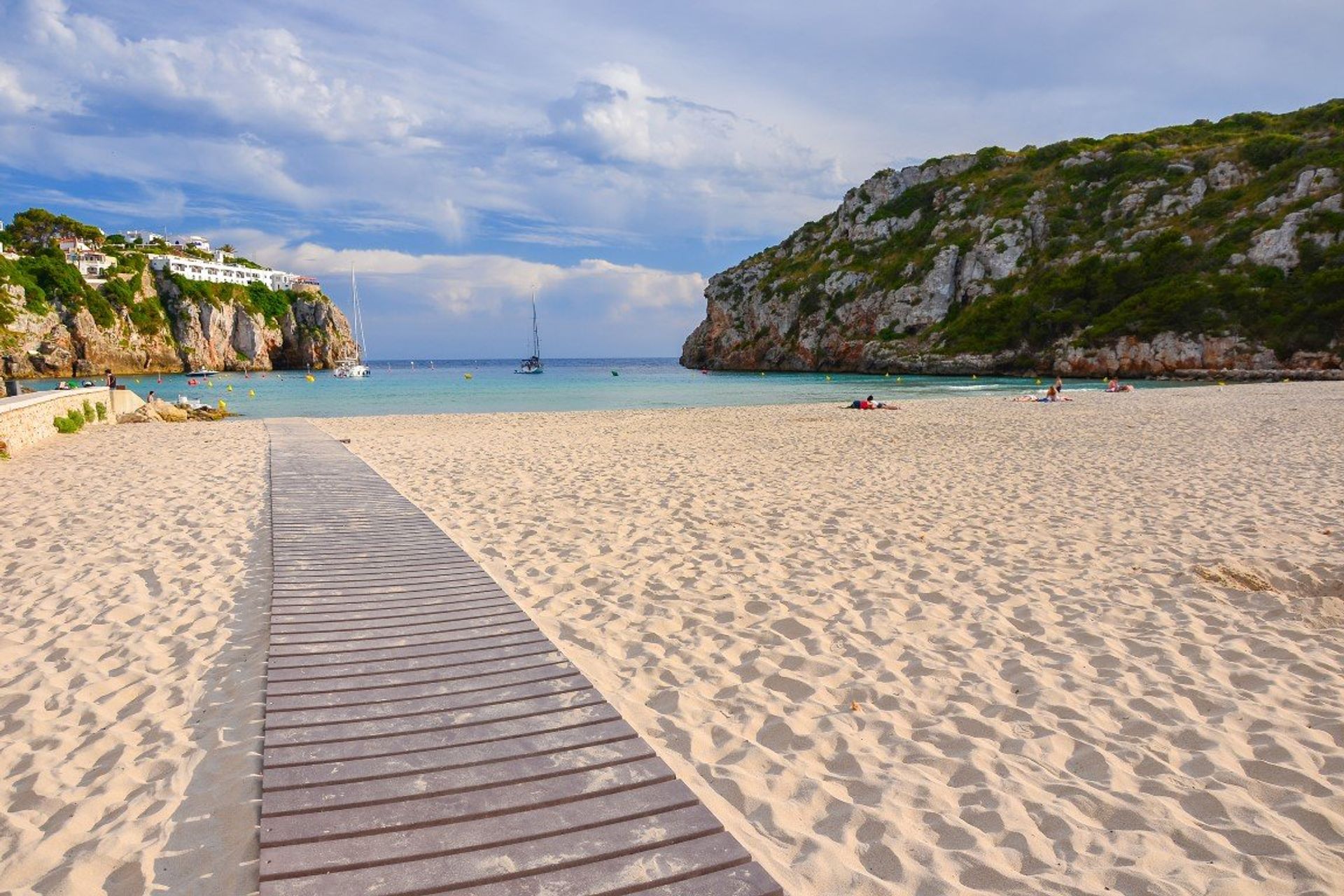 Unwind on the gentle sloping white sands of Cala en Porter