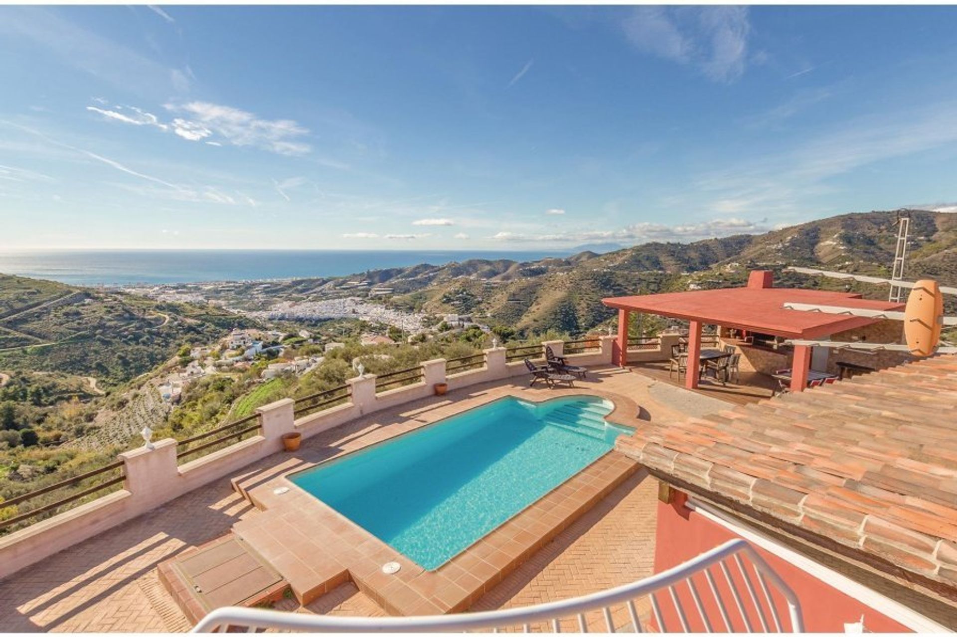 Enjoy panoramic views of the countryside from your villa's pool