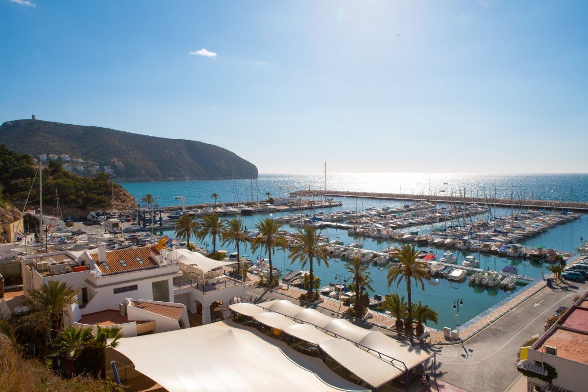 The beautiful sports marina with Penon de Ifach Natural Park, in the distance