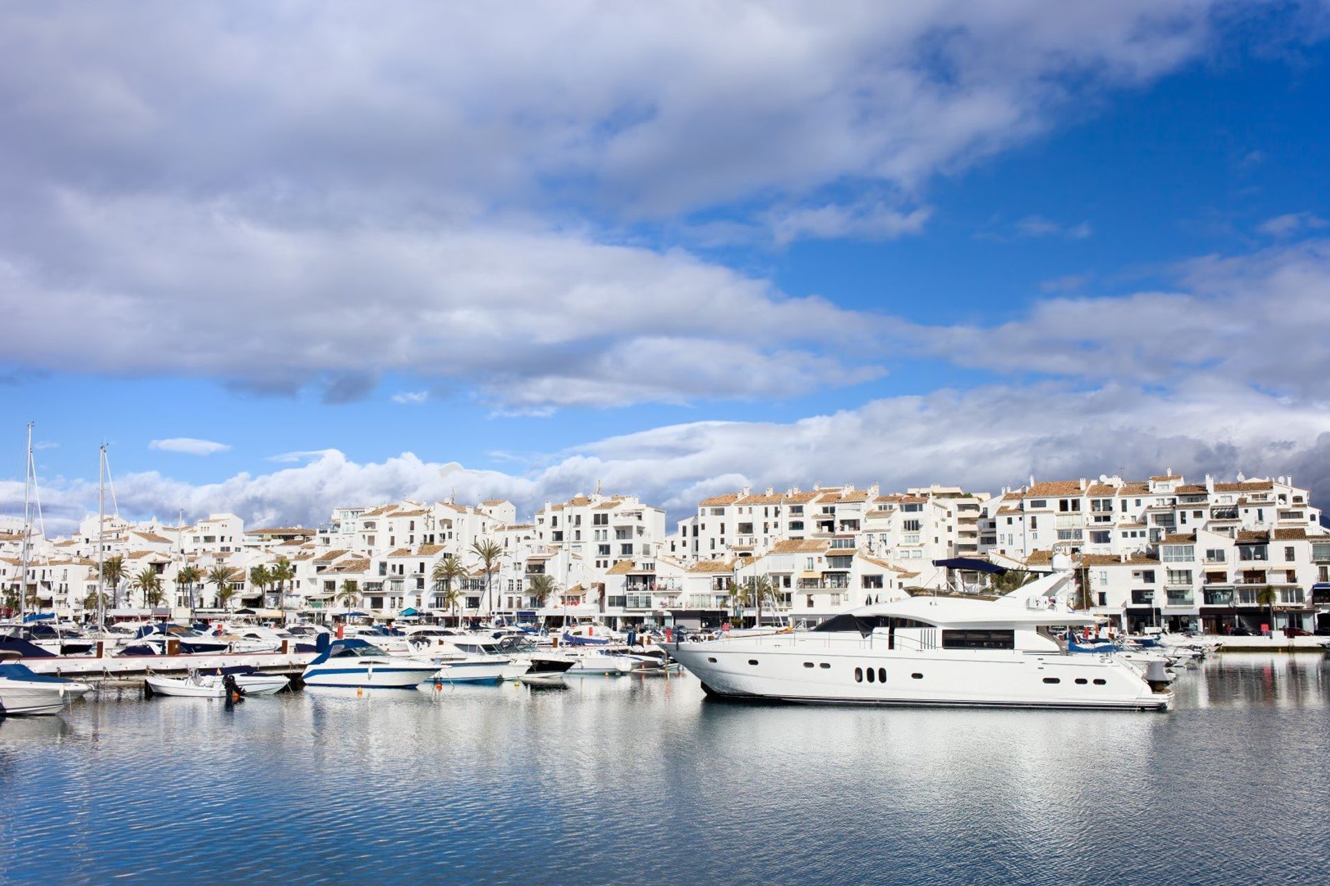 Take an evening walk along Puerto Banus marina dotted with luxury yachts and boats 