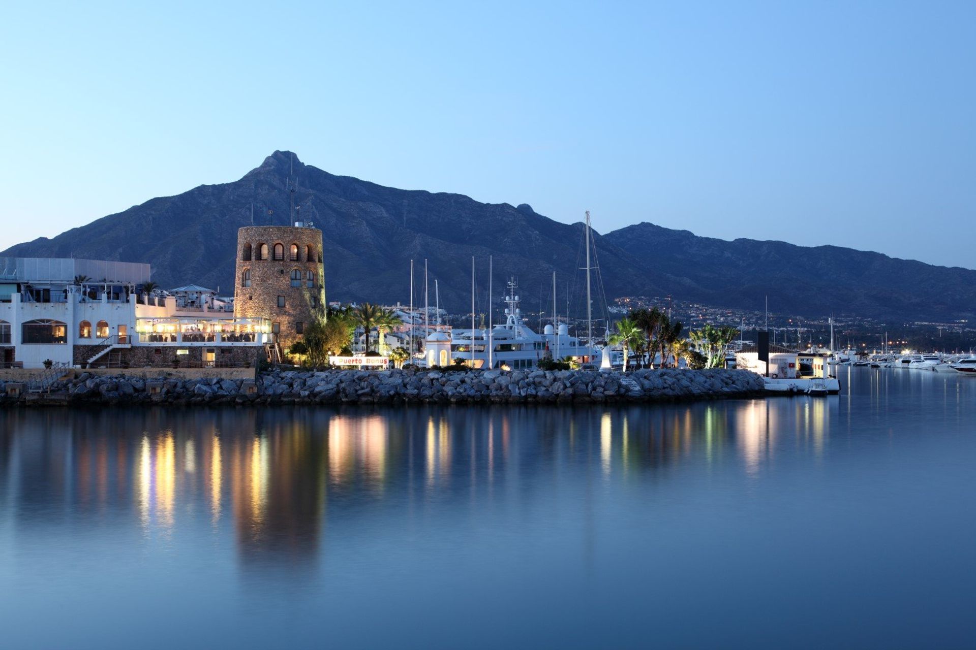 Enjoy a nice alfresco dinner at one of the many waterfront restaurants with scenic views of Puerto Banus' watchtower