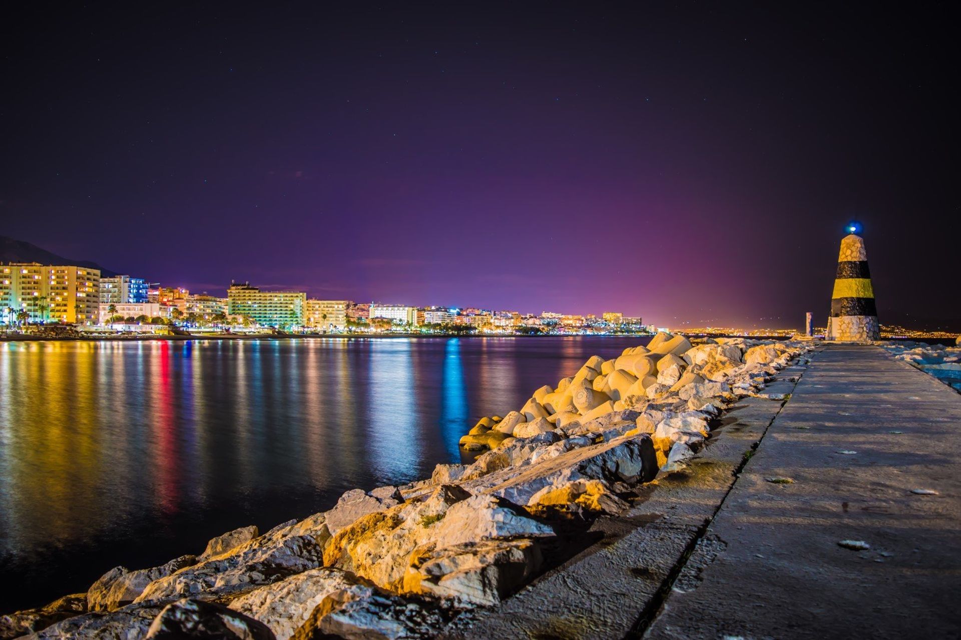 Watch the promenade come to life with a sunset evening stroll along the coast