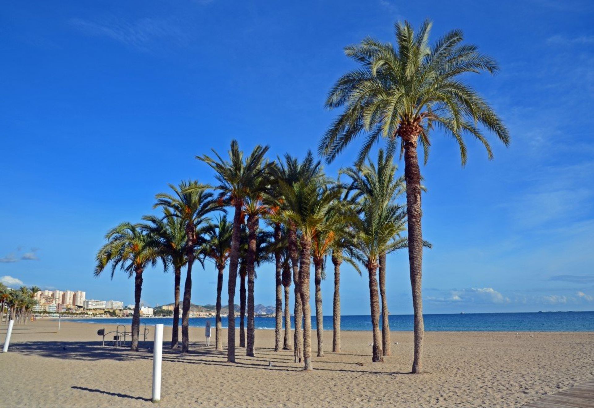 Take a morning stroll down Paradis beach and take a dip in its calm waters