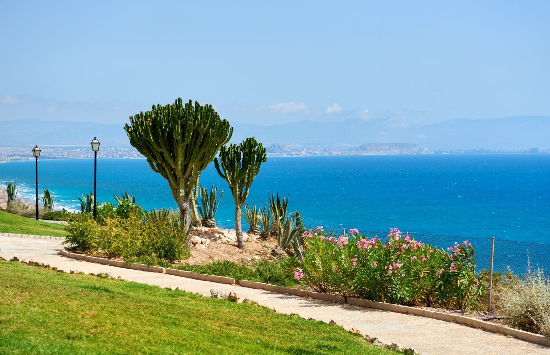 Enjoy a relaxing stroll down Carabassi beach promenade with a beautiful backdrop of the sparkling Mediterranean