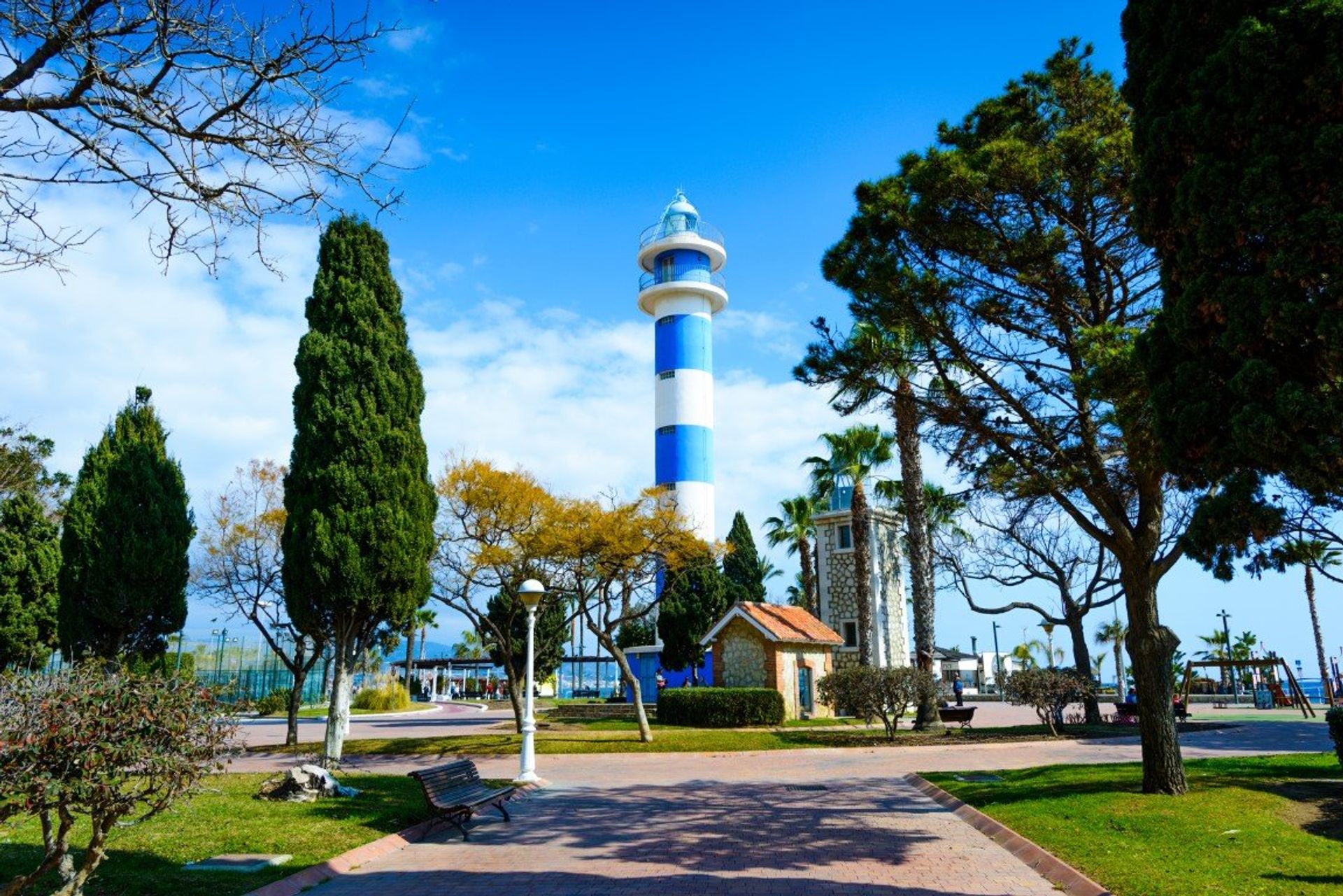 Torre del Mar's iconic 18th century lighthouse overlooking the seafront promenade and Meditterranean