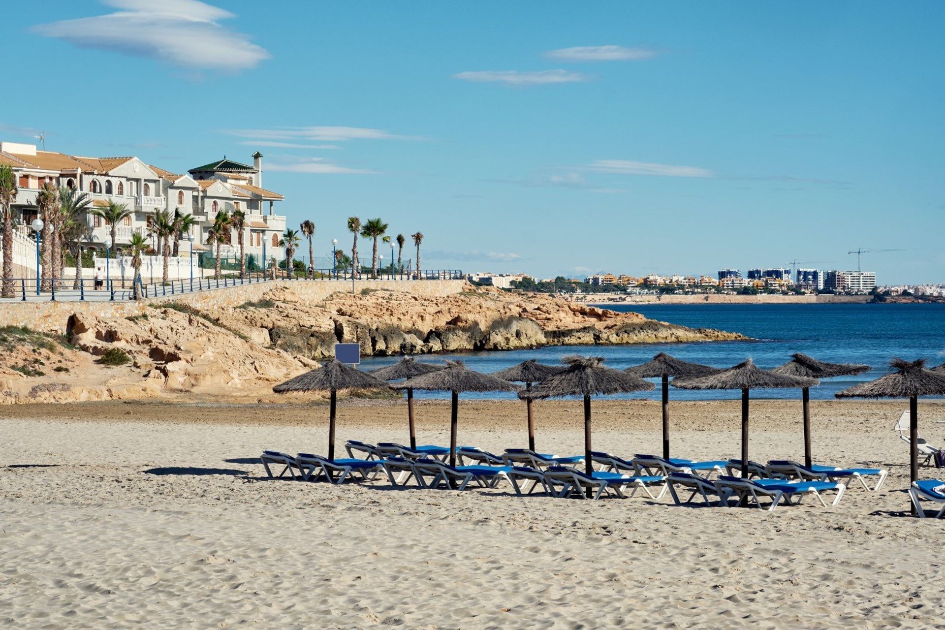 Sit back, relax and and enjoy the gentle sea breeze through your hair on low-key Cala Capitan beach