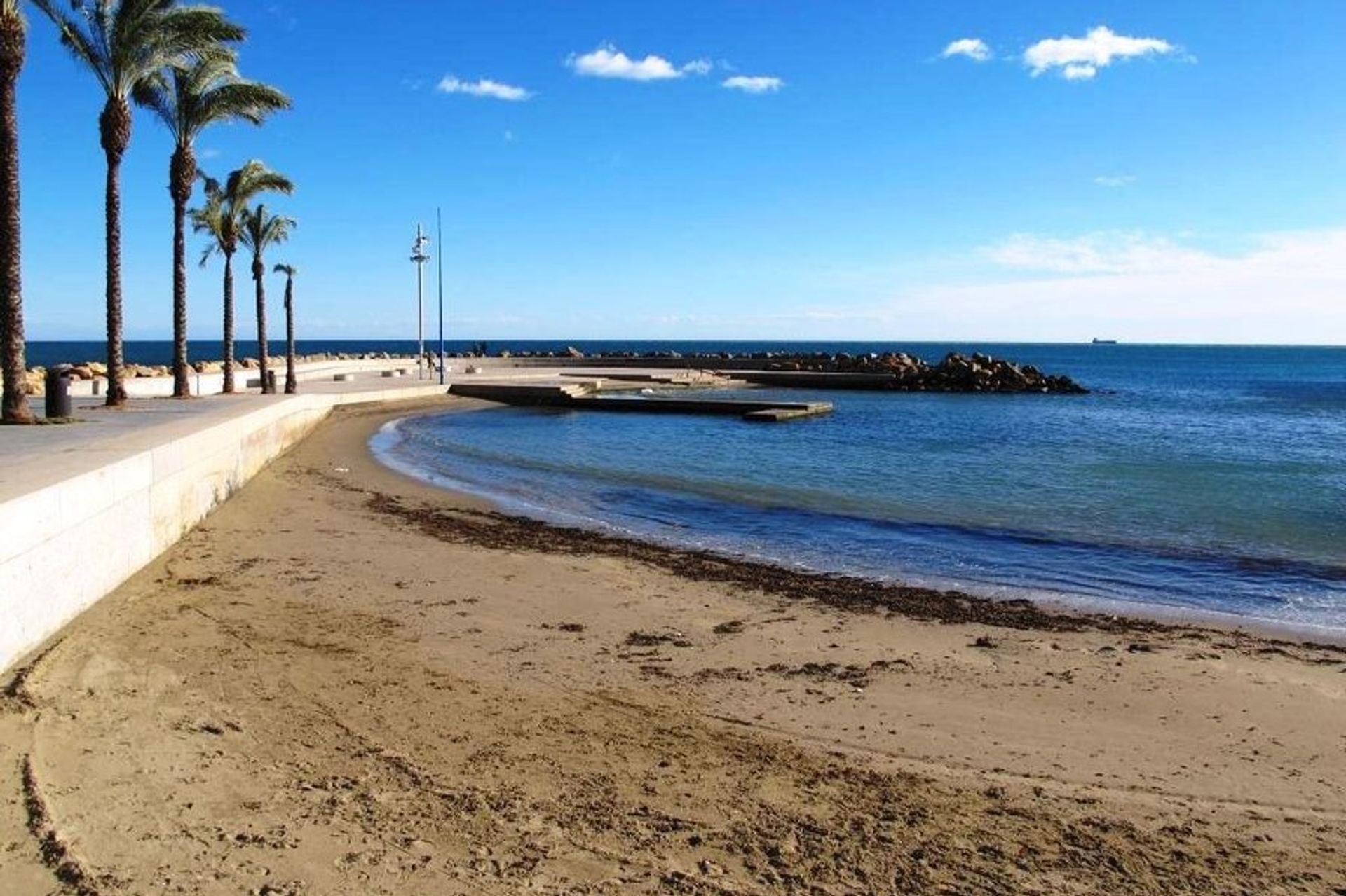 Take a relaxing afternoon stroll along La Zenia's beach promenade after a long day in the sun