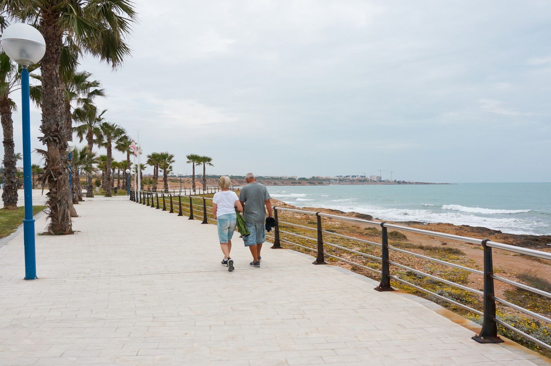 Enjoy a relaxing stroll down the beach promenade with a beautiful backdrop of the sparkling Mediterranean