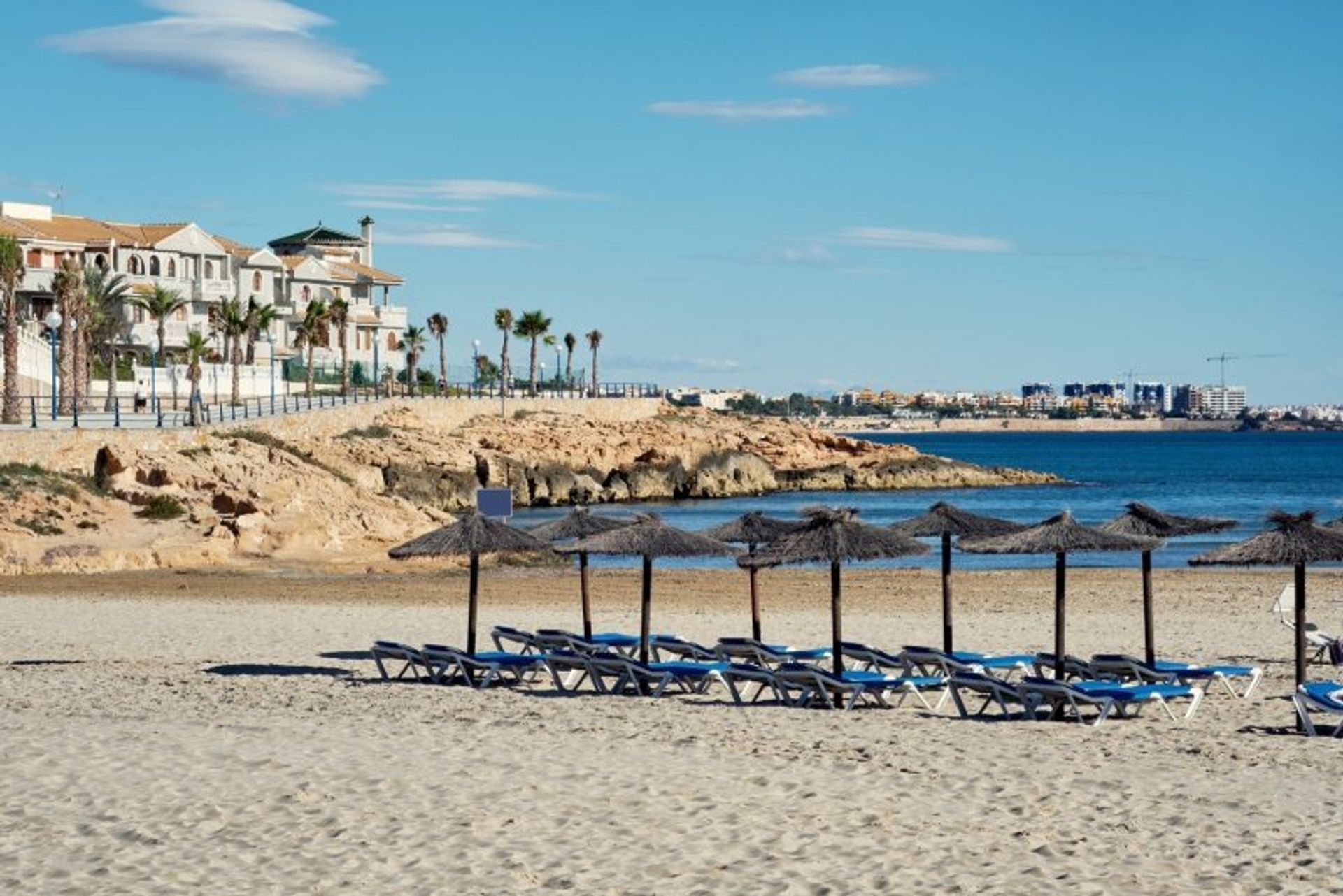 Sit back, relax and and enjoy the summer breeze through your hair on Cabo Roig's Cala Capitan beach