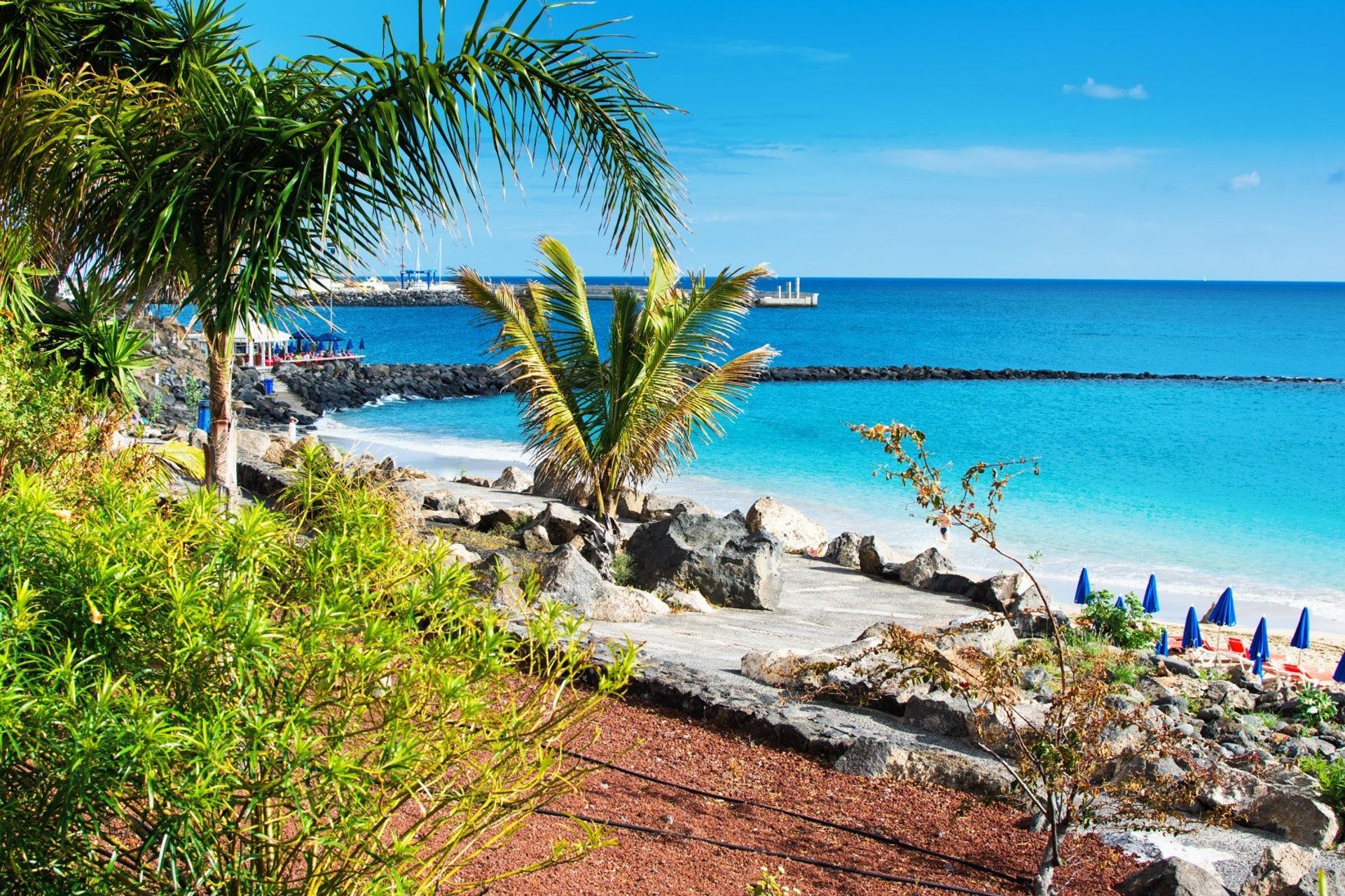 Nestled behind a stunning man-made cove, try your hand at water sports on Playa Dorada