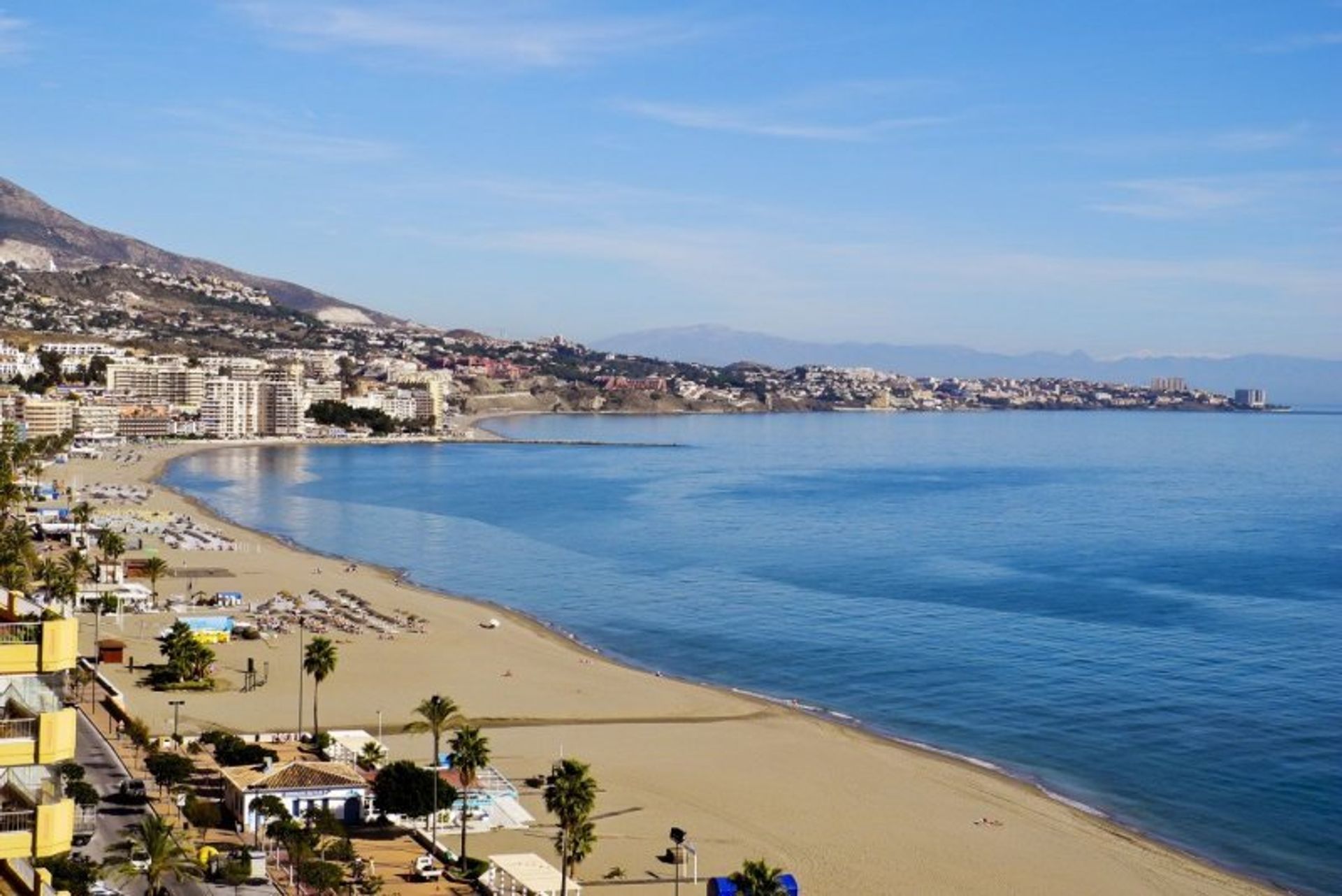 People watch, sunbathe or bask in the sun on neighbouring Fuengirola's Santa Amalia beach