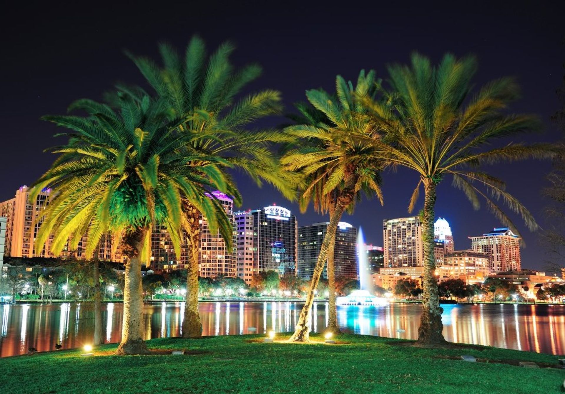 Watch the sun set over Lake Eola over downtown Orlando
