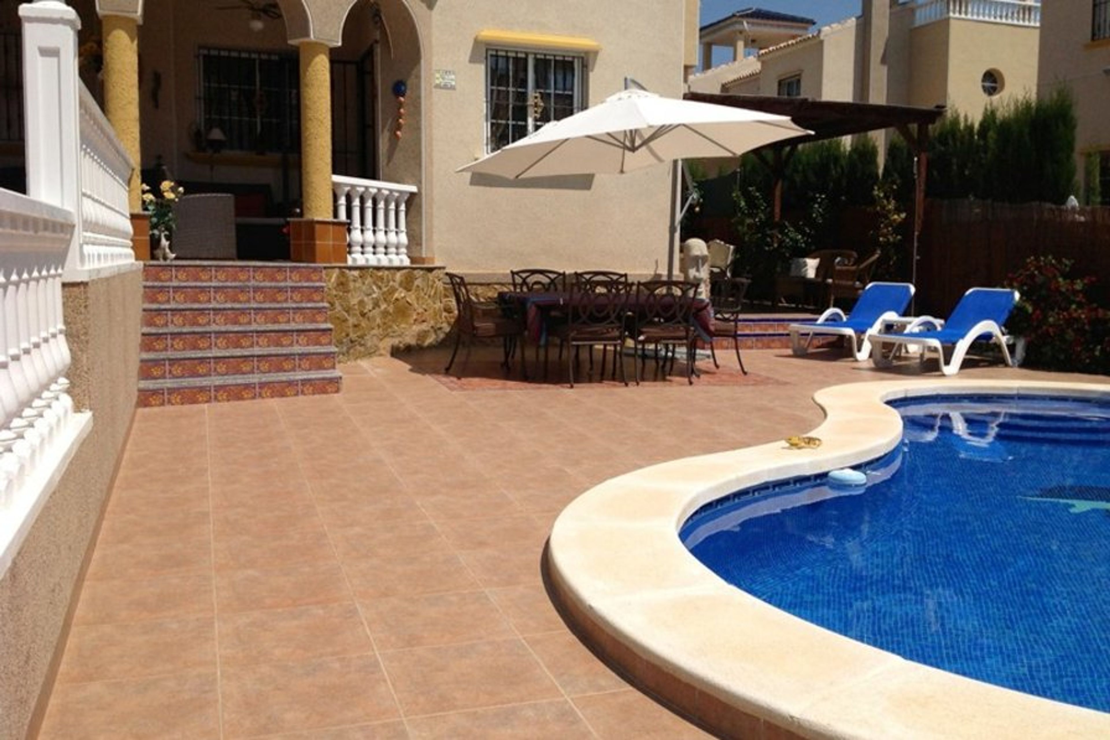 Front entrance to villa and pool and patio area.