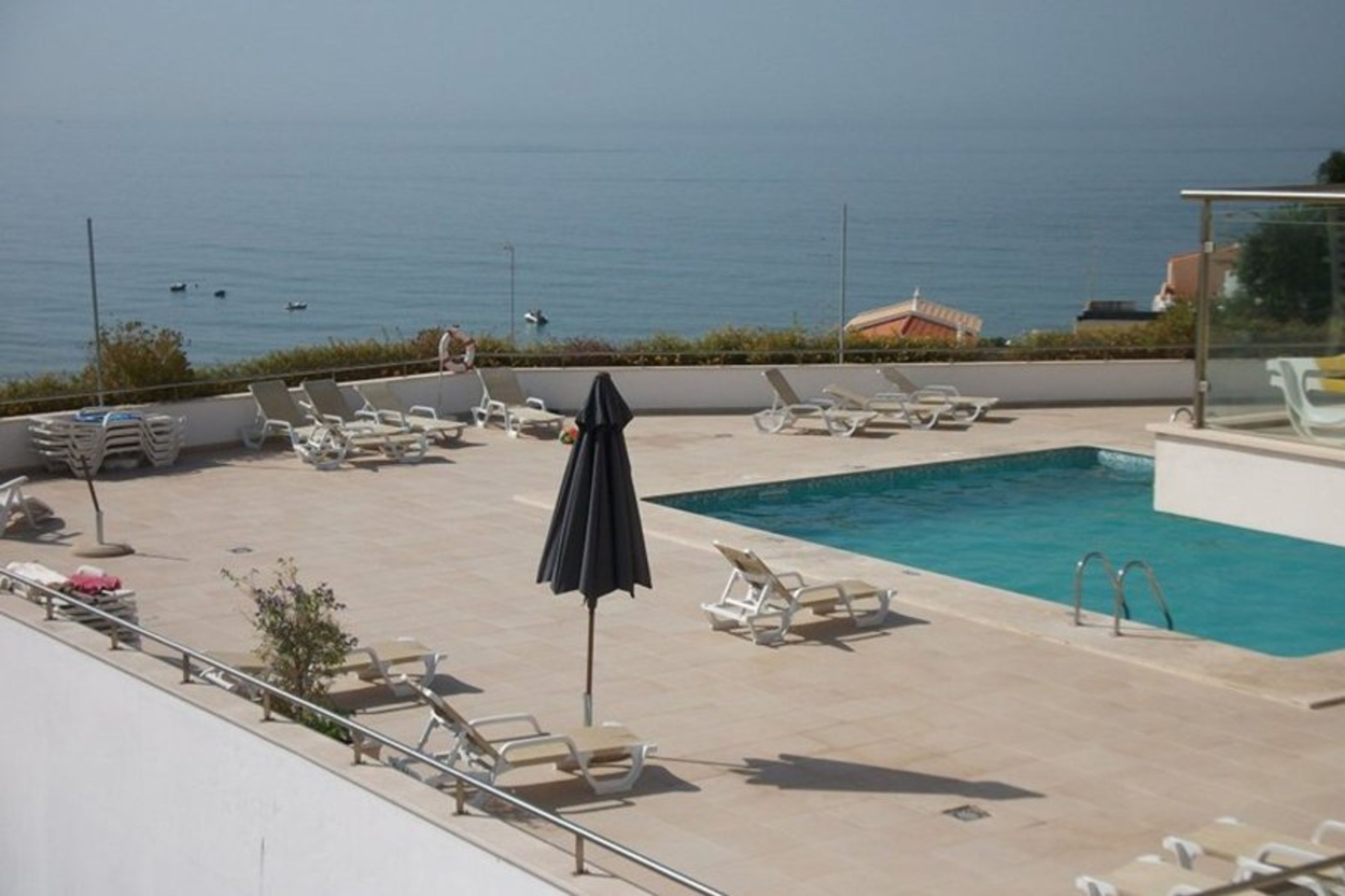 Swimming Pool overlooking sea and beach