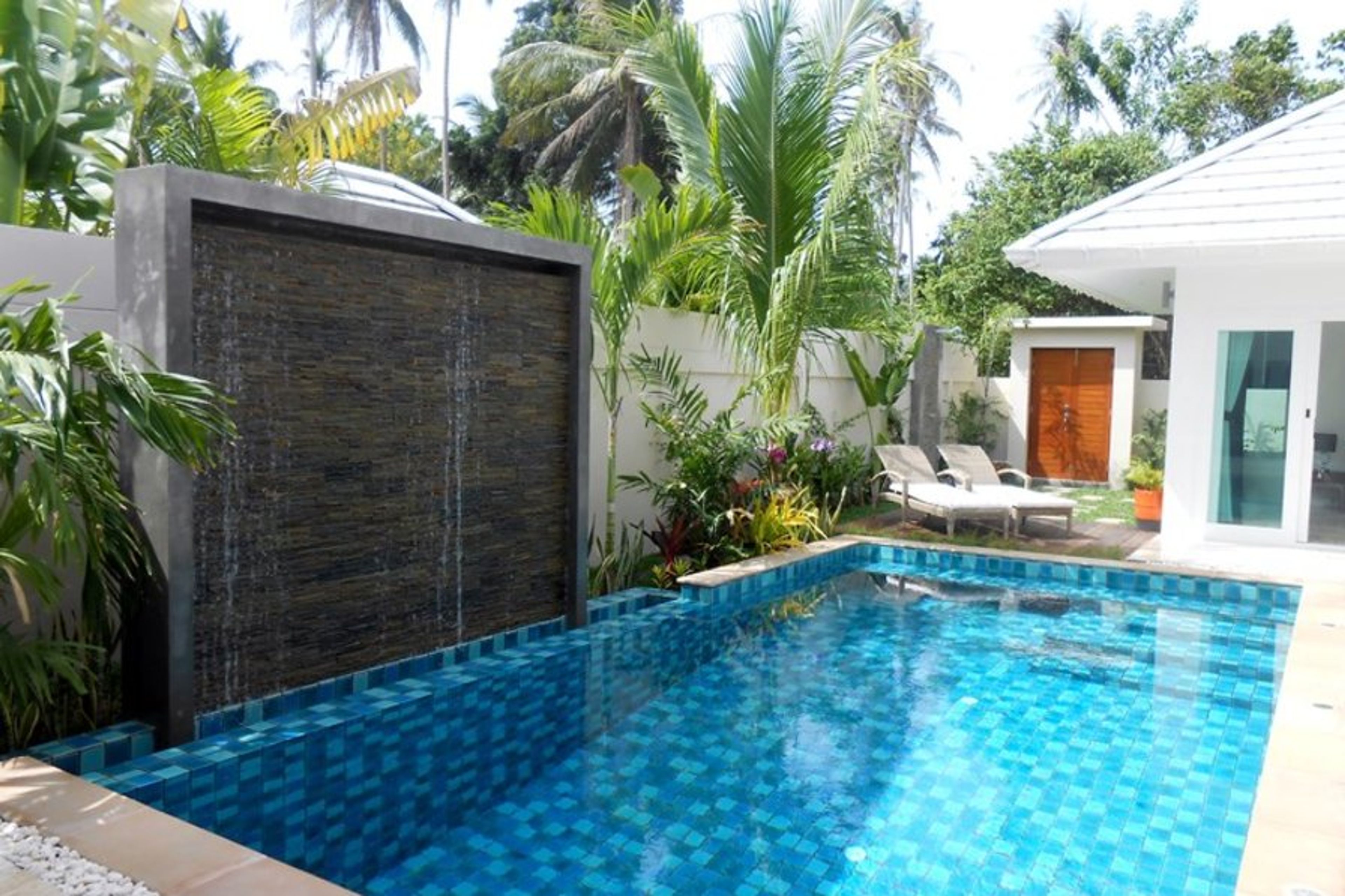 The Pool, deck and relaxing waterfall