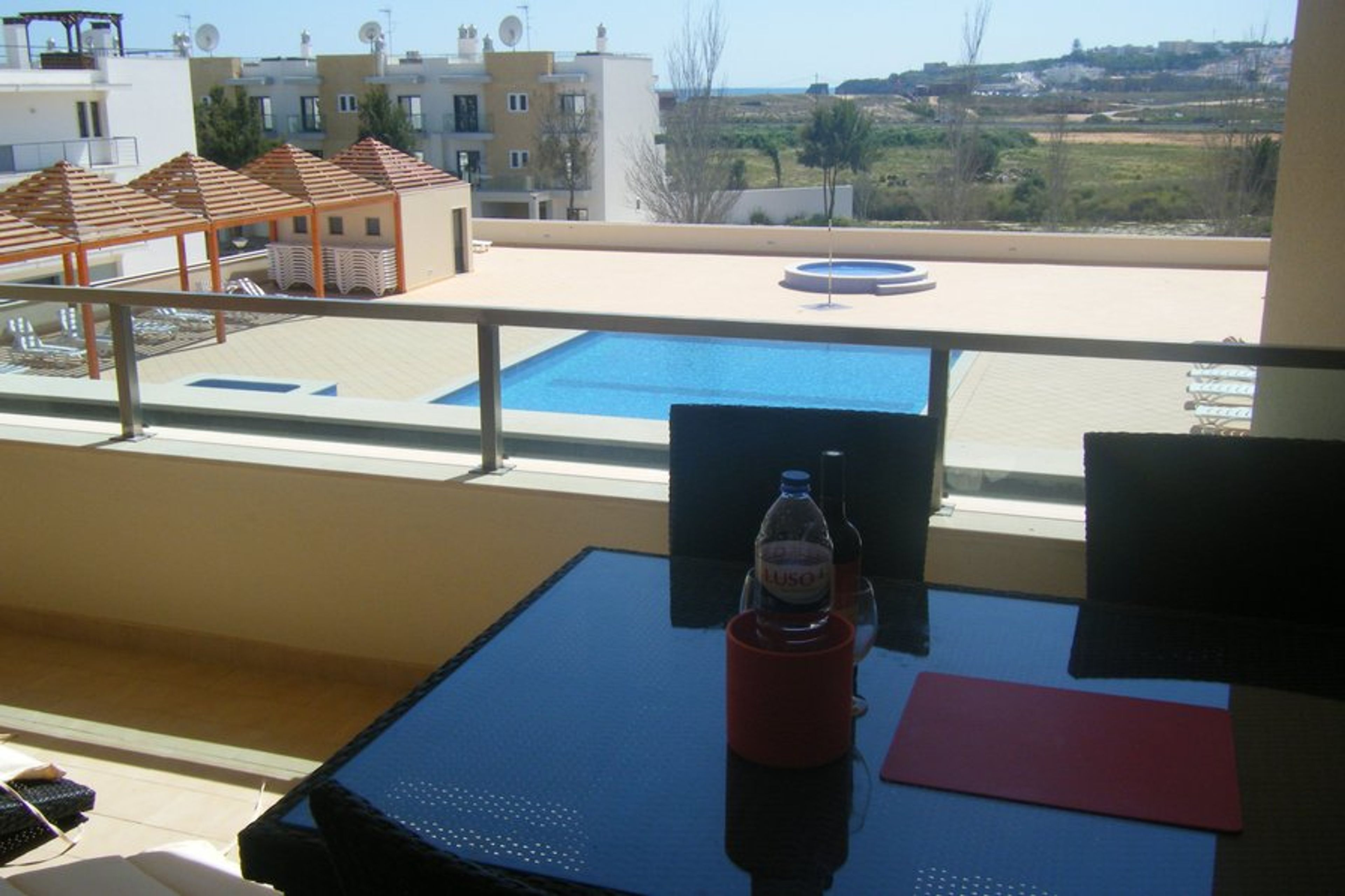 Large south-facing balcony overlooking the pool